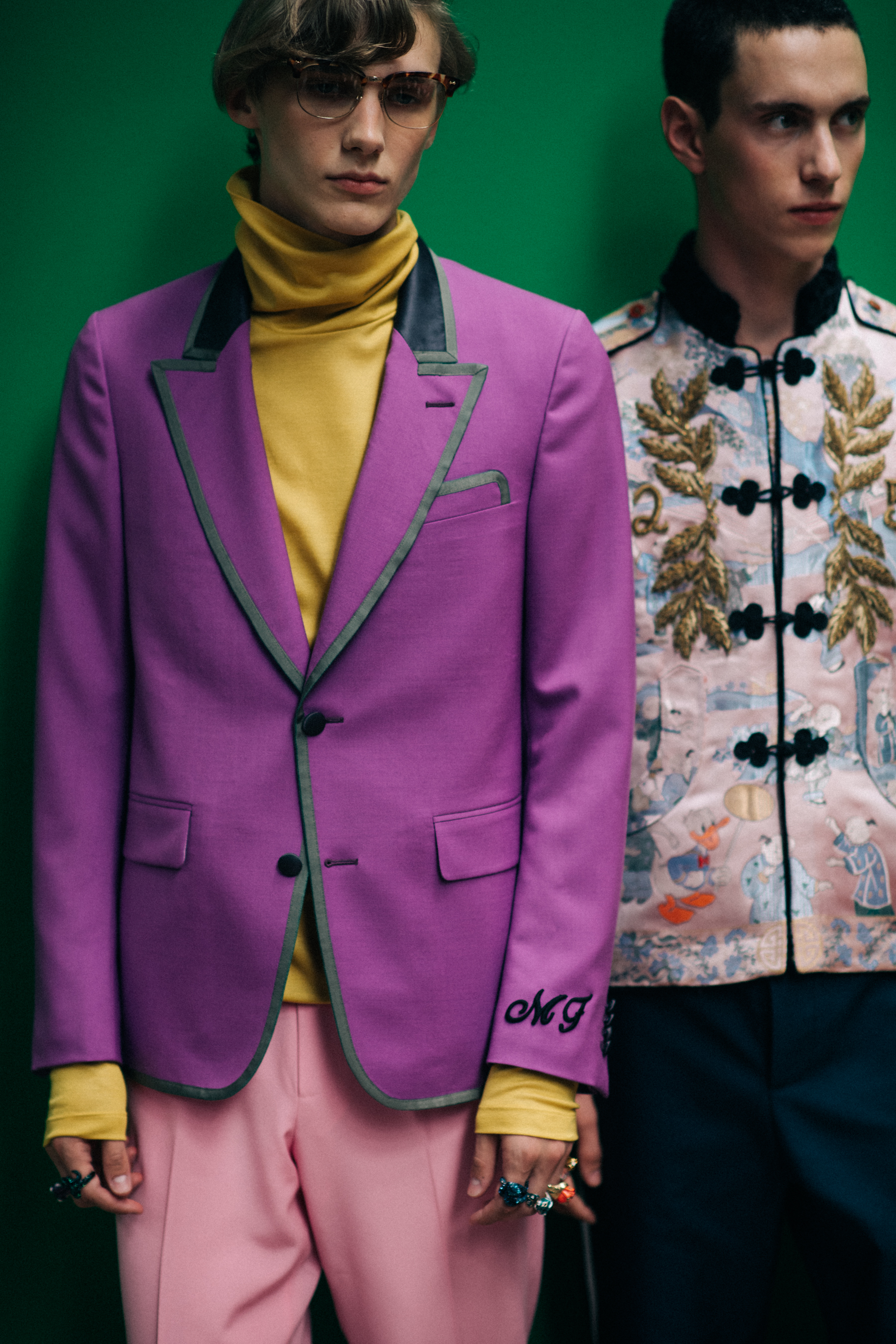Two male models posing together