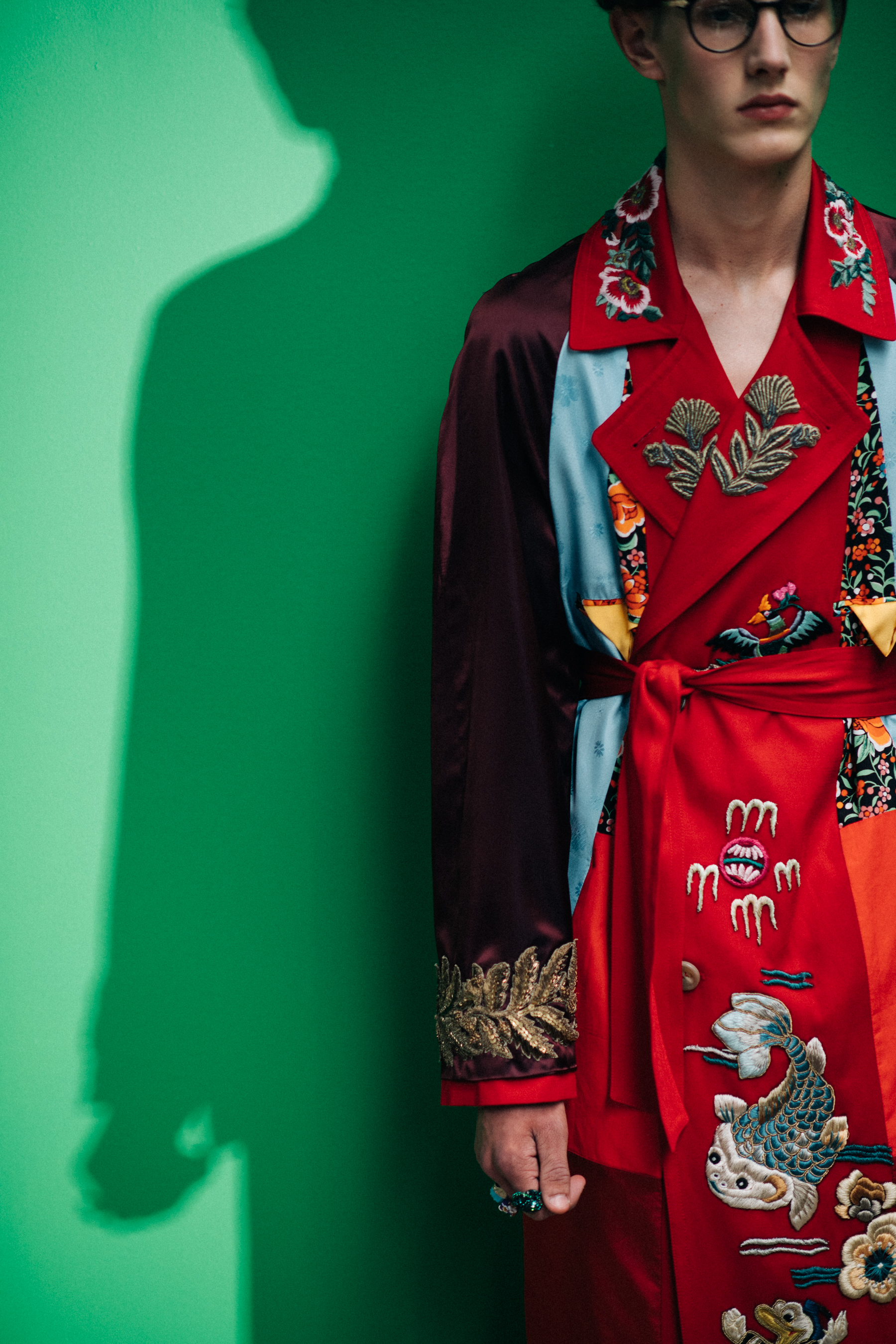 A model wearing a red coat