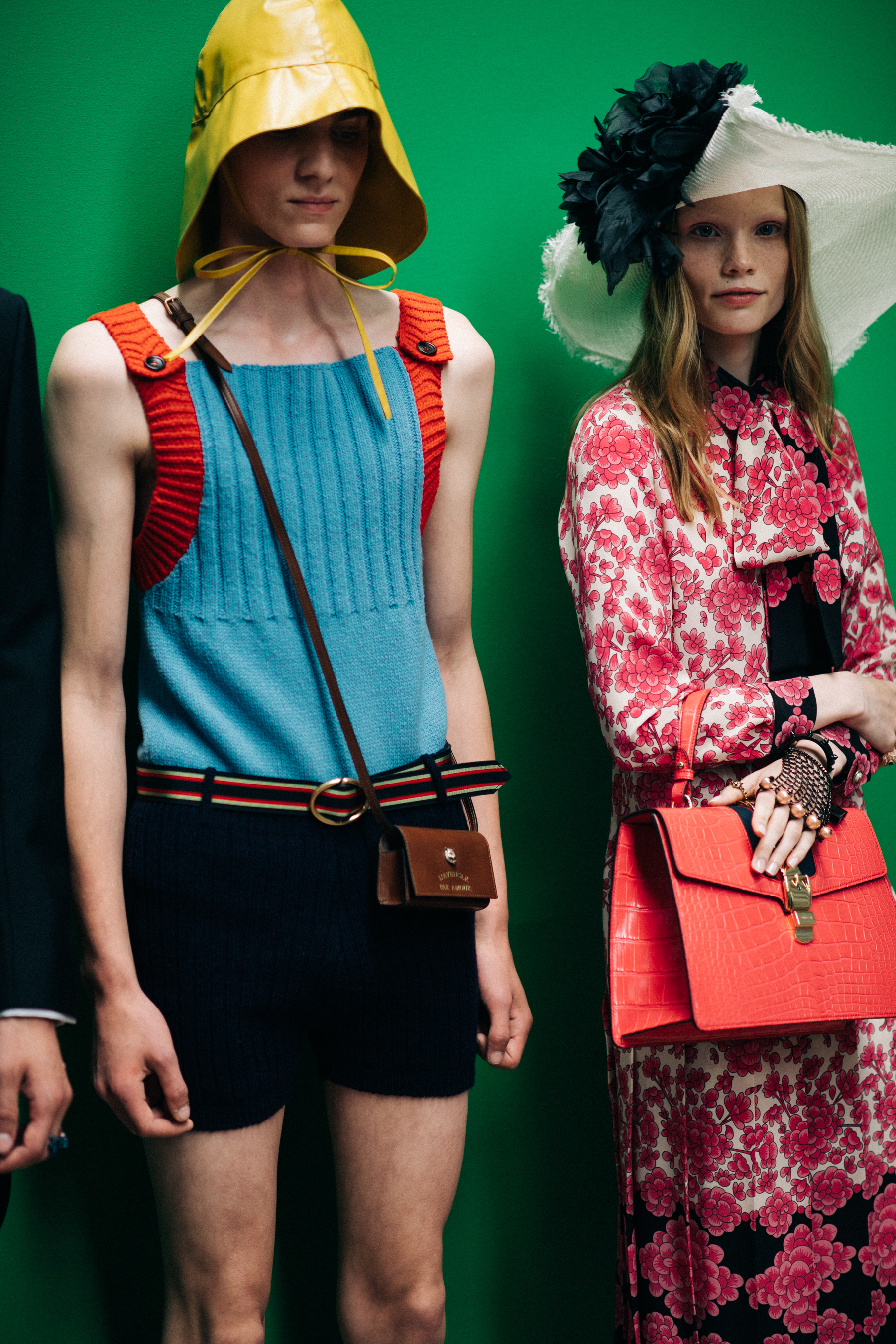 Models in bright outfits posing together