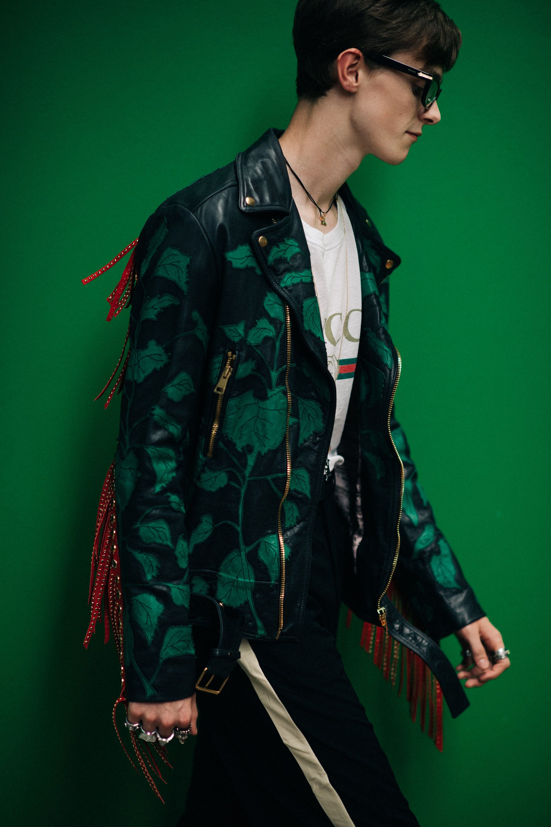A man in a green leather jacket