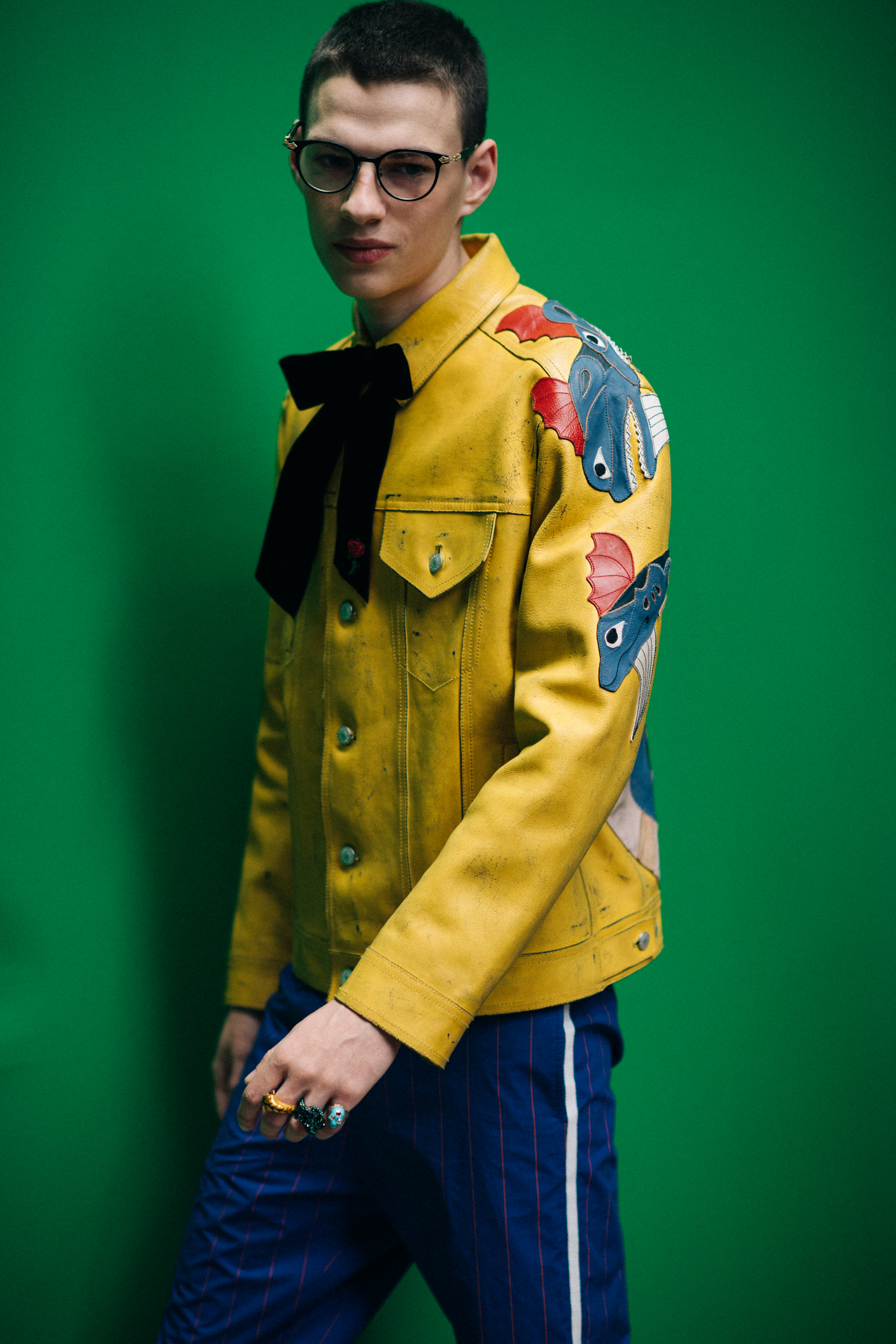 A man in a yellow leather jacket