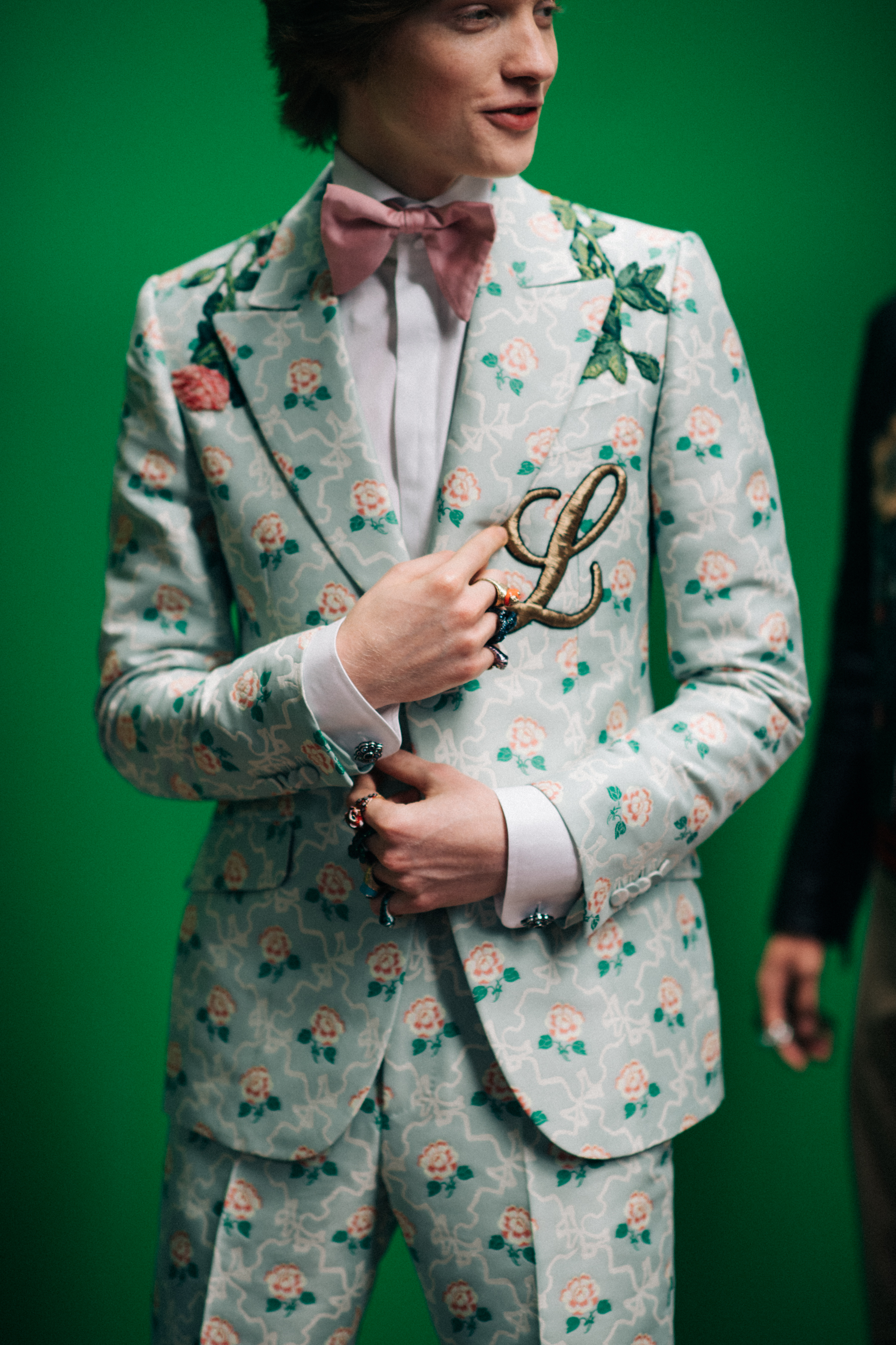A man in a jacket with flowers