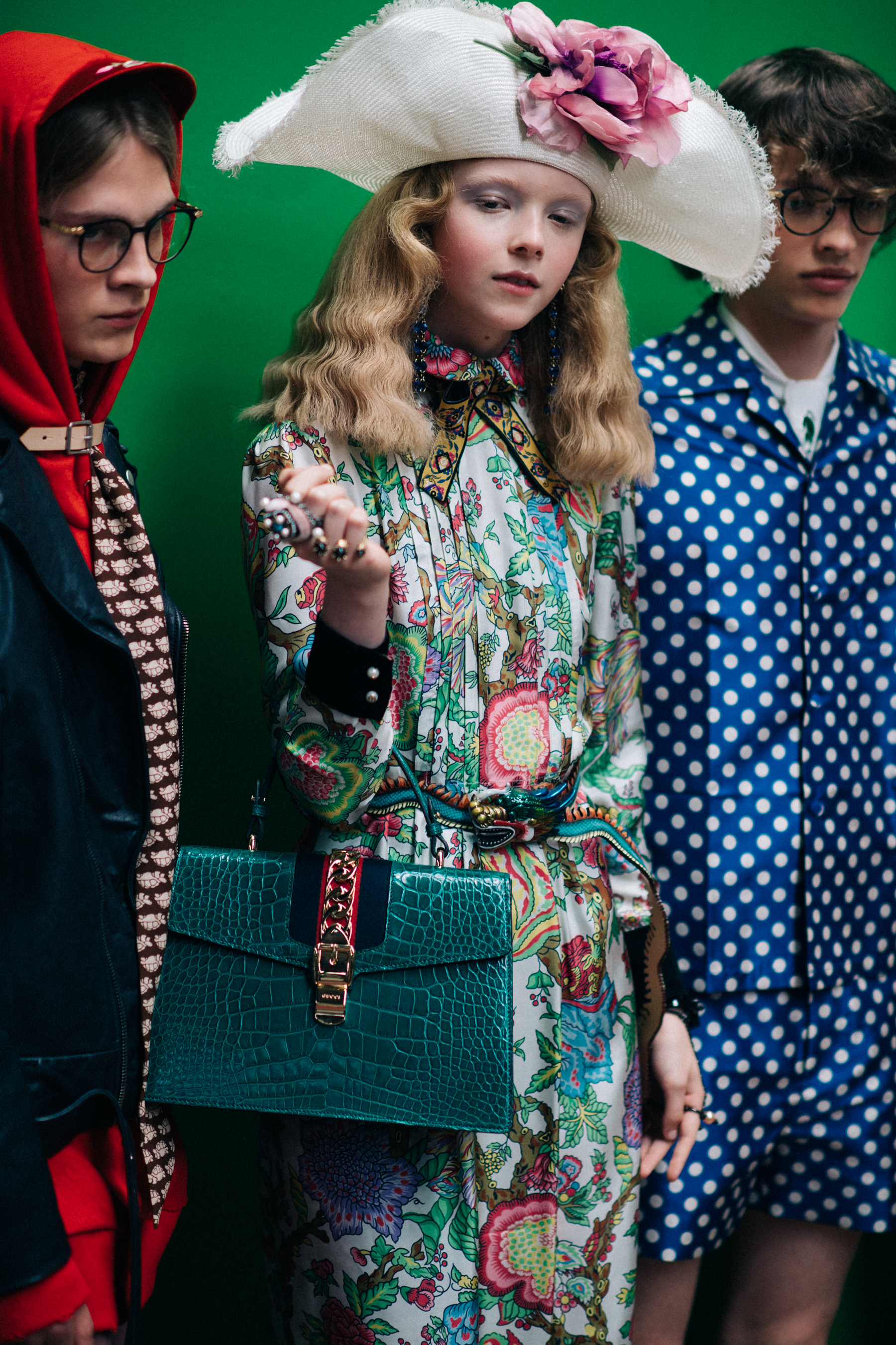 Models in bright outfits posing together