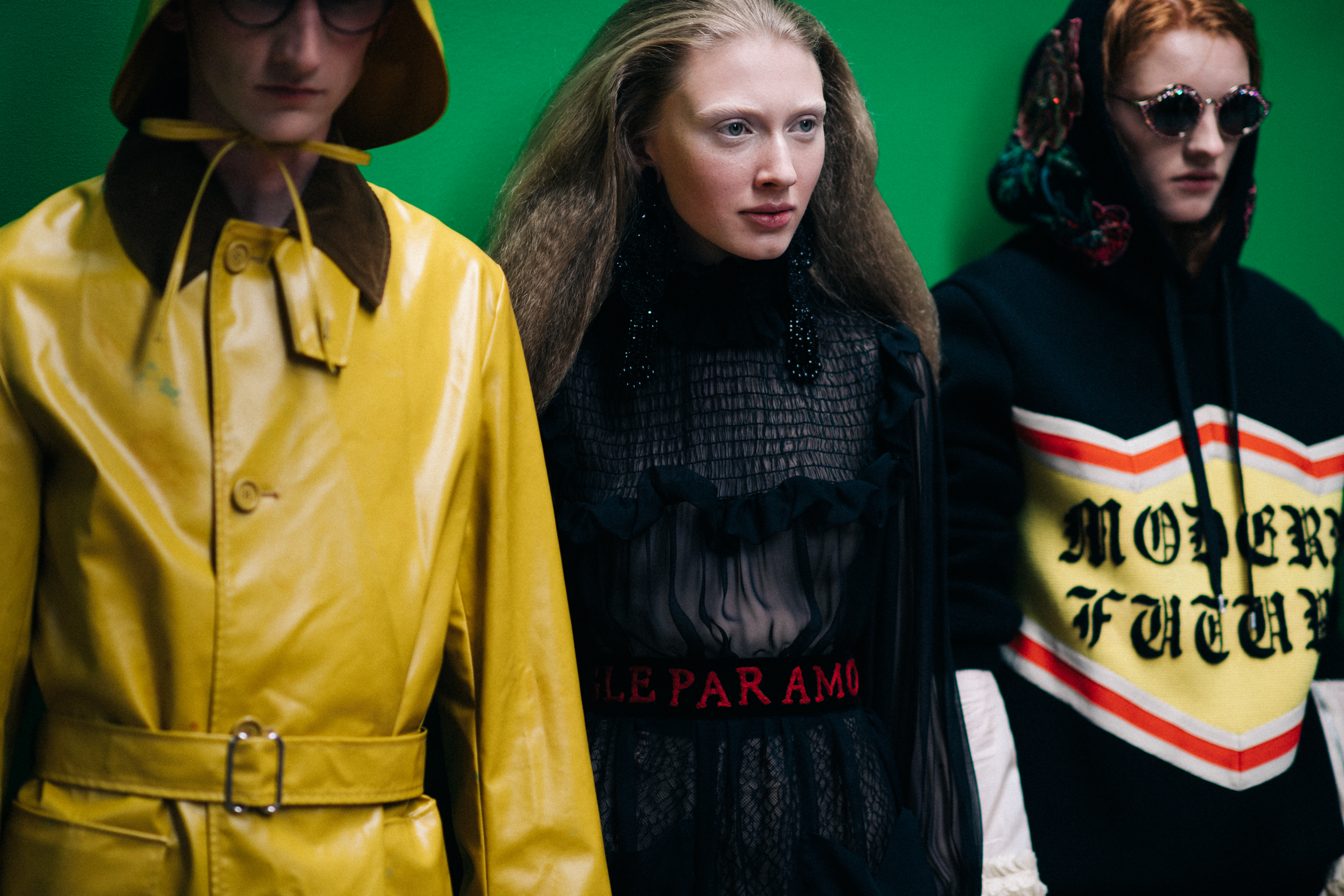 Models in black and yellow outfits