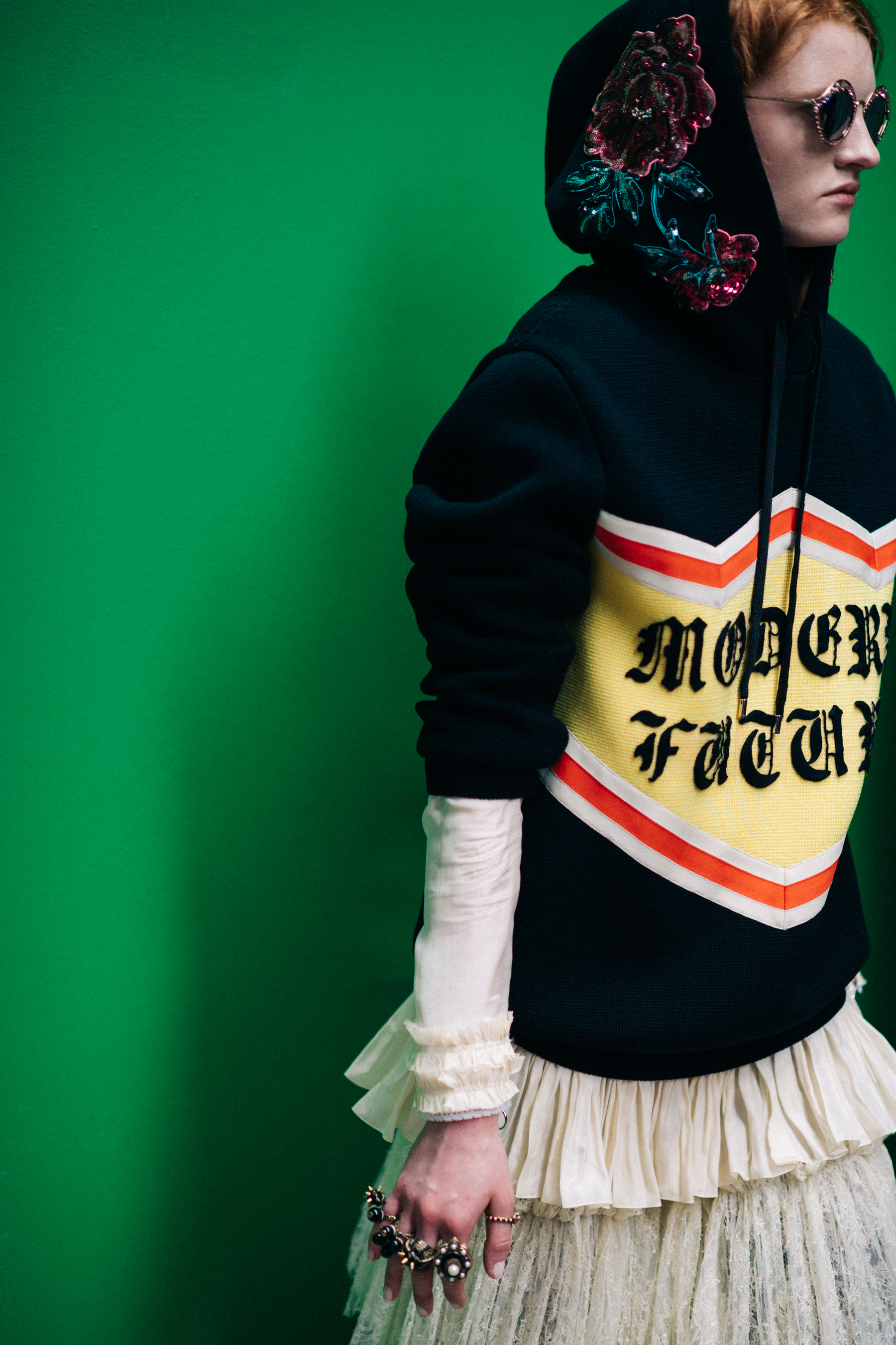 A model wearing a printed sweatshirt