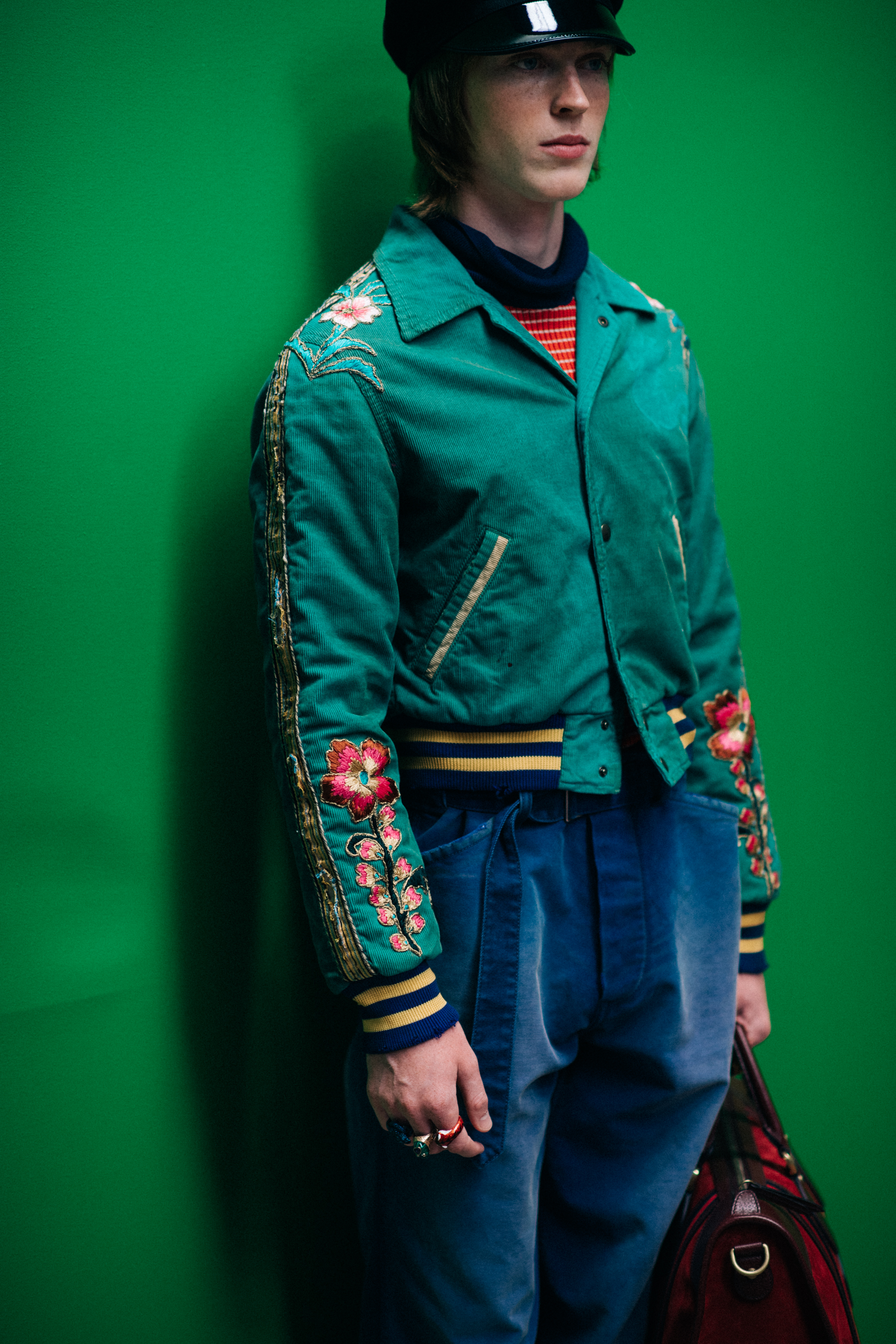 A model in a green jacket