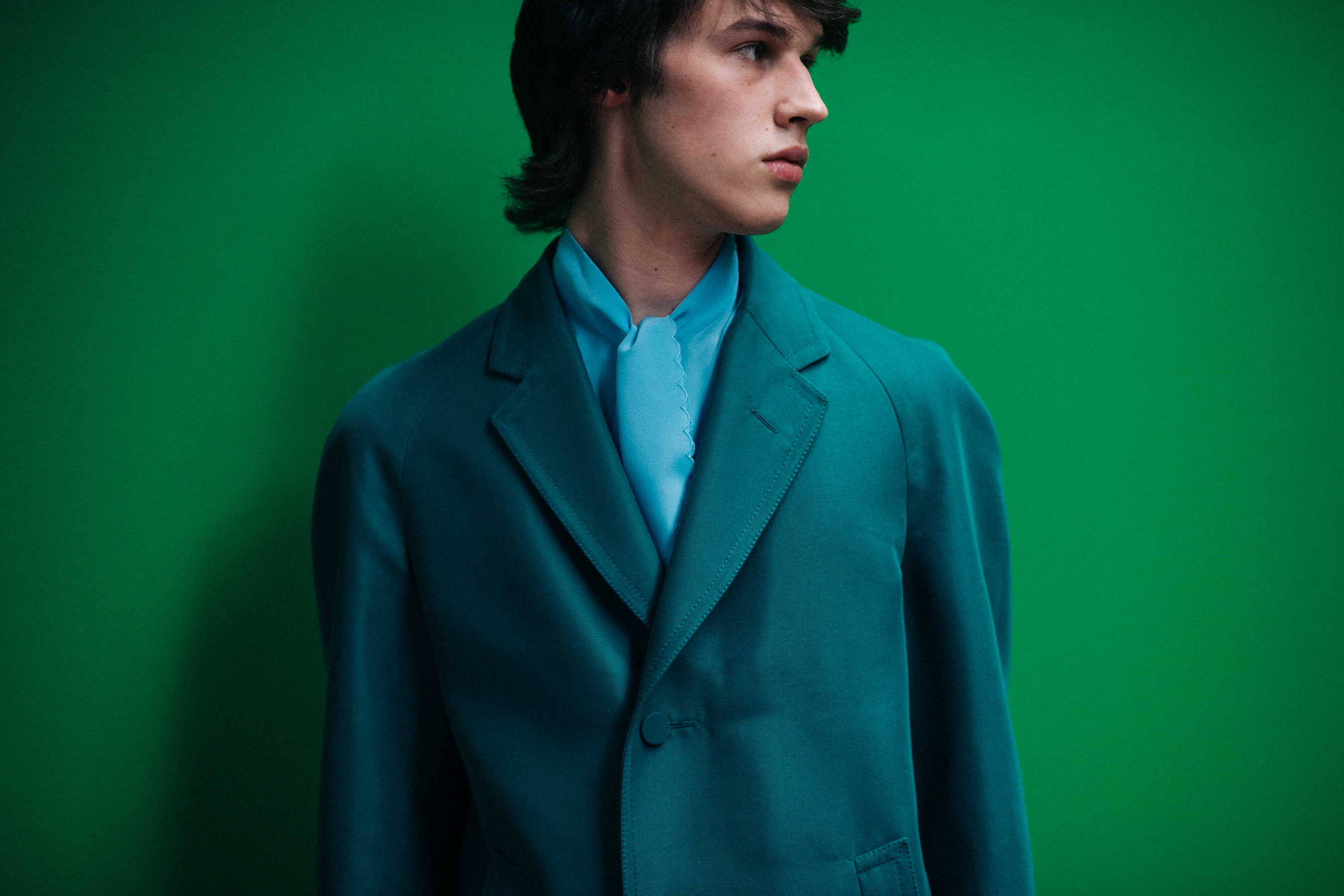 A model in green on green