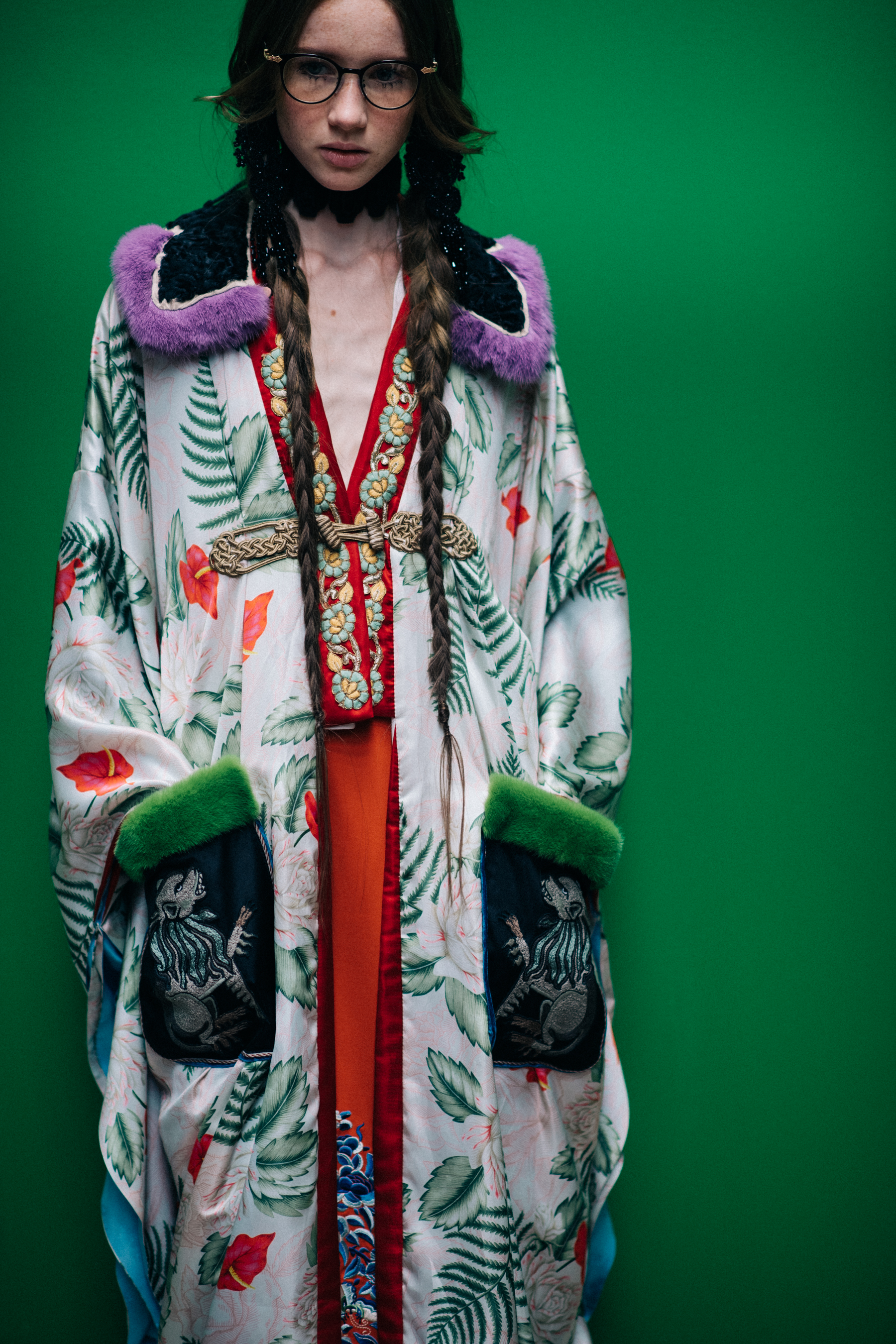 A model in a long coat with pockets