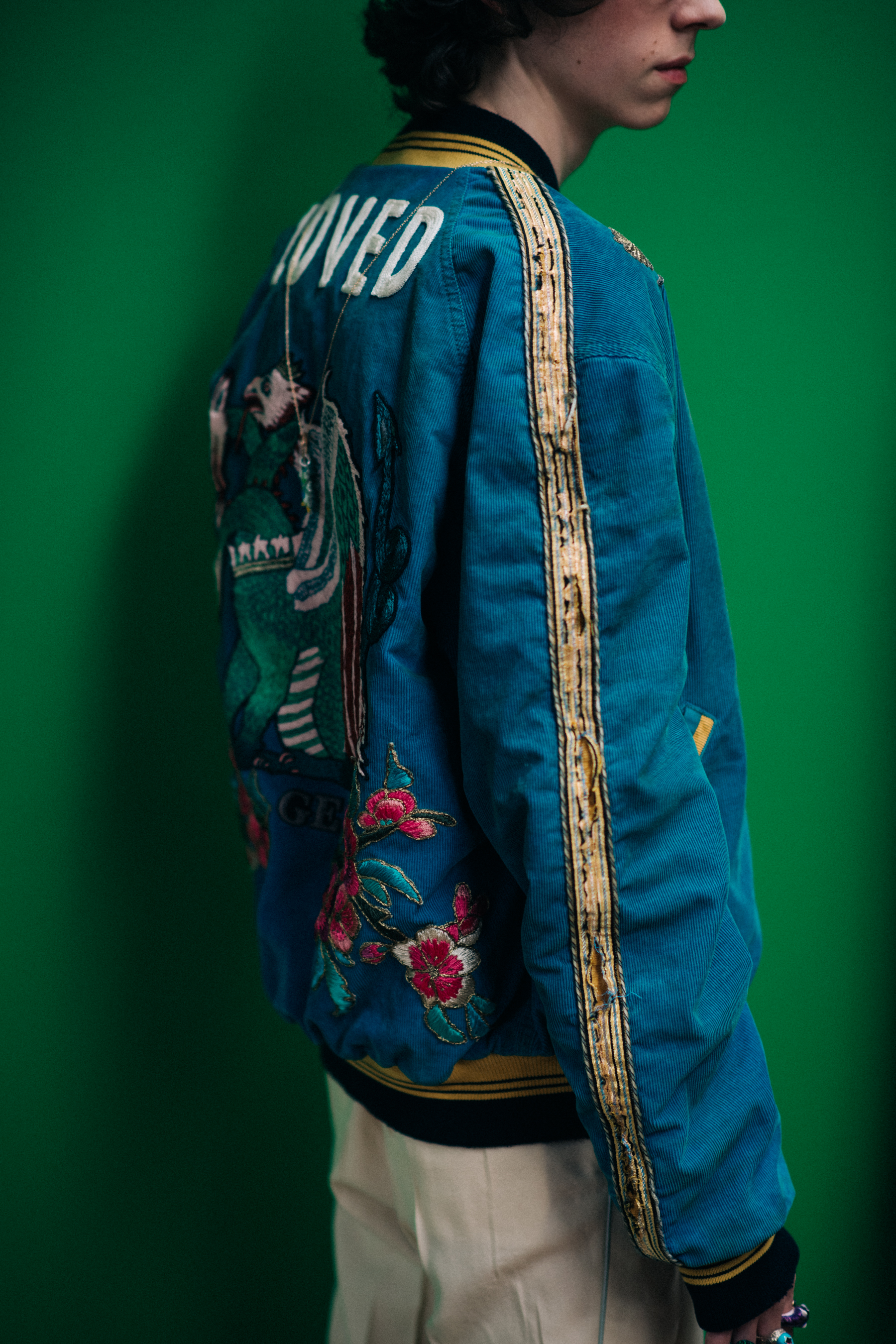A man in a jacket with embroidery