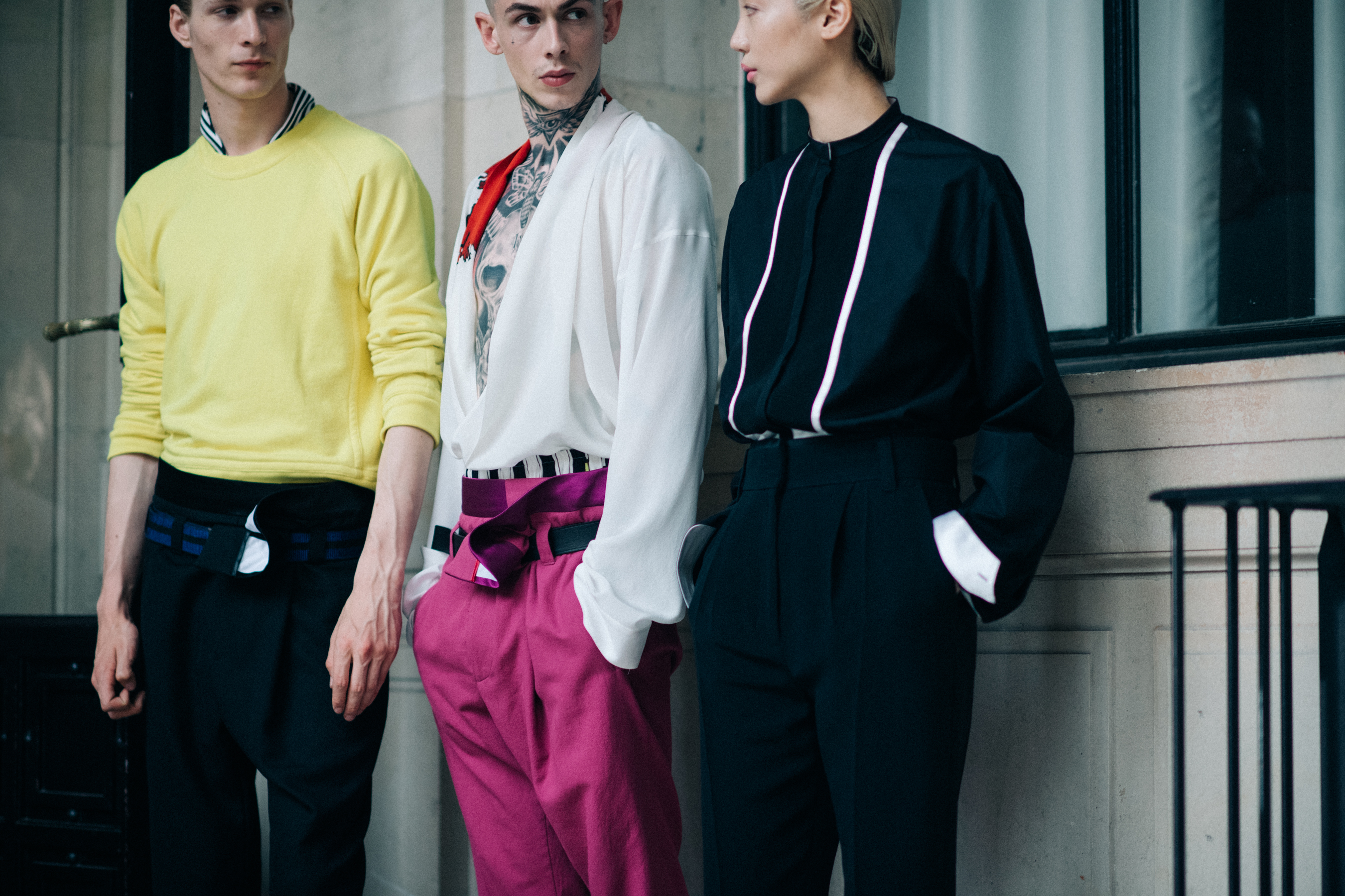 Male models wearing pink and yellow