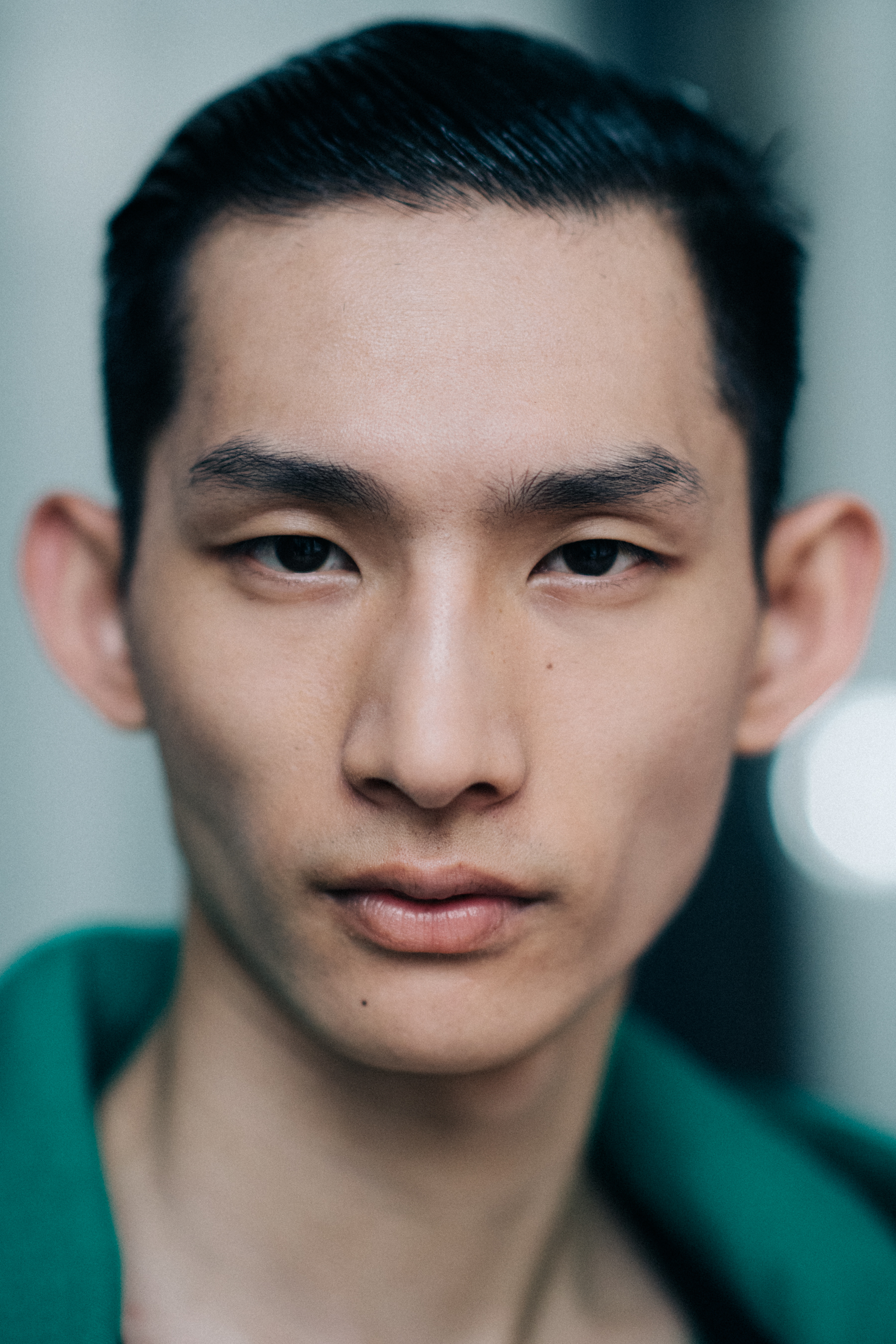 An Asian male model posing