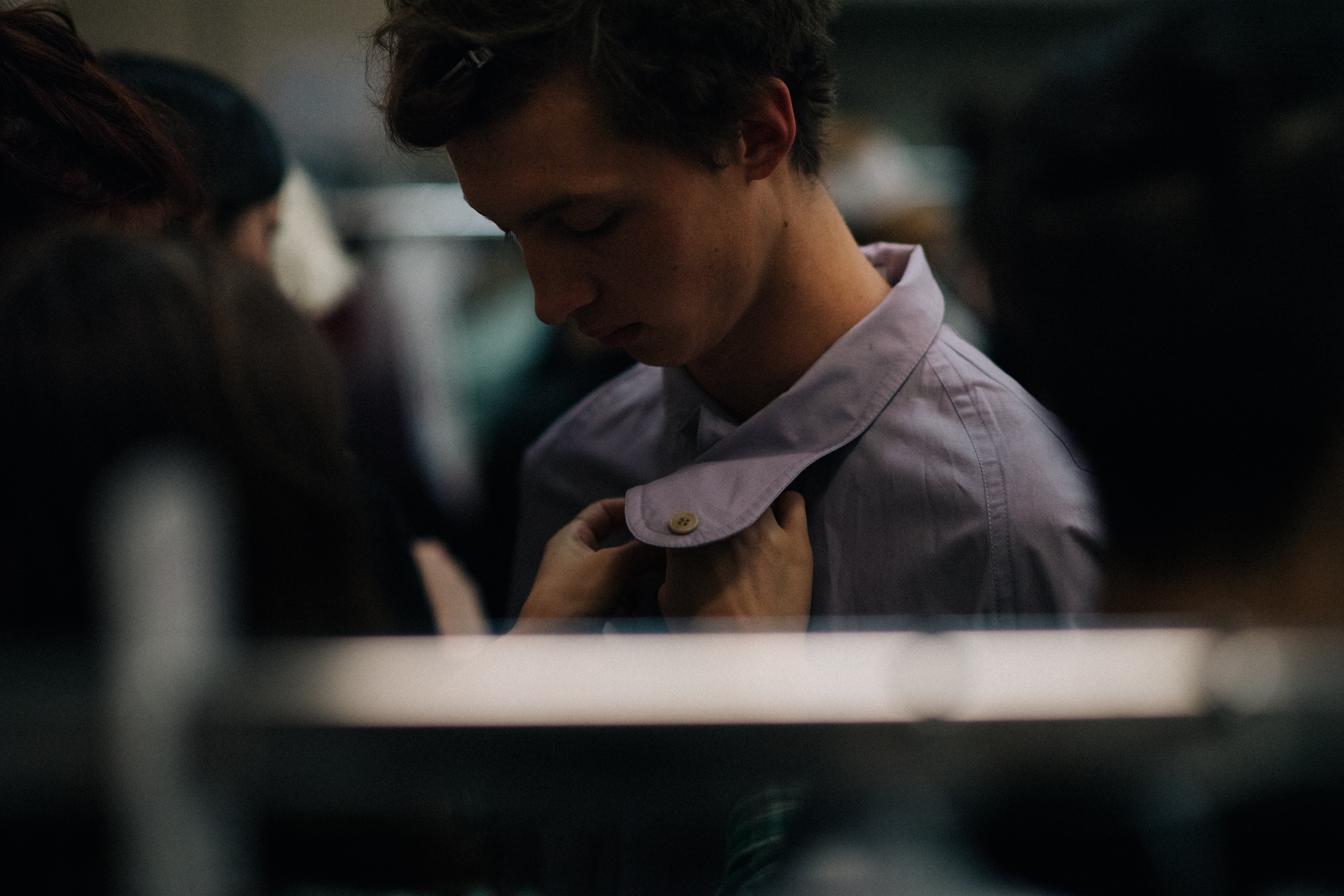 Male model getting dressed
