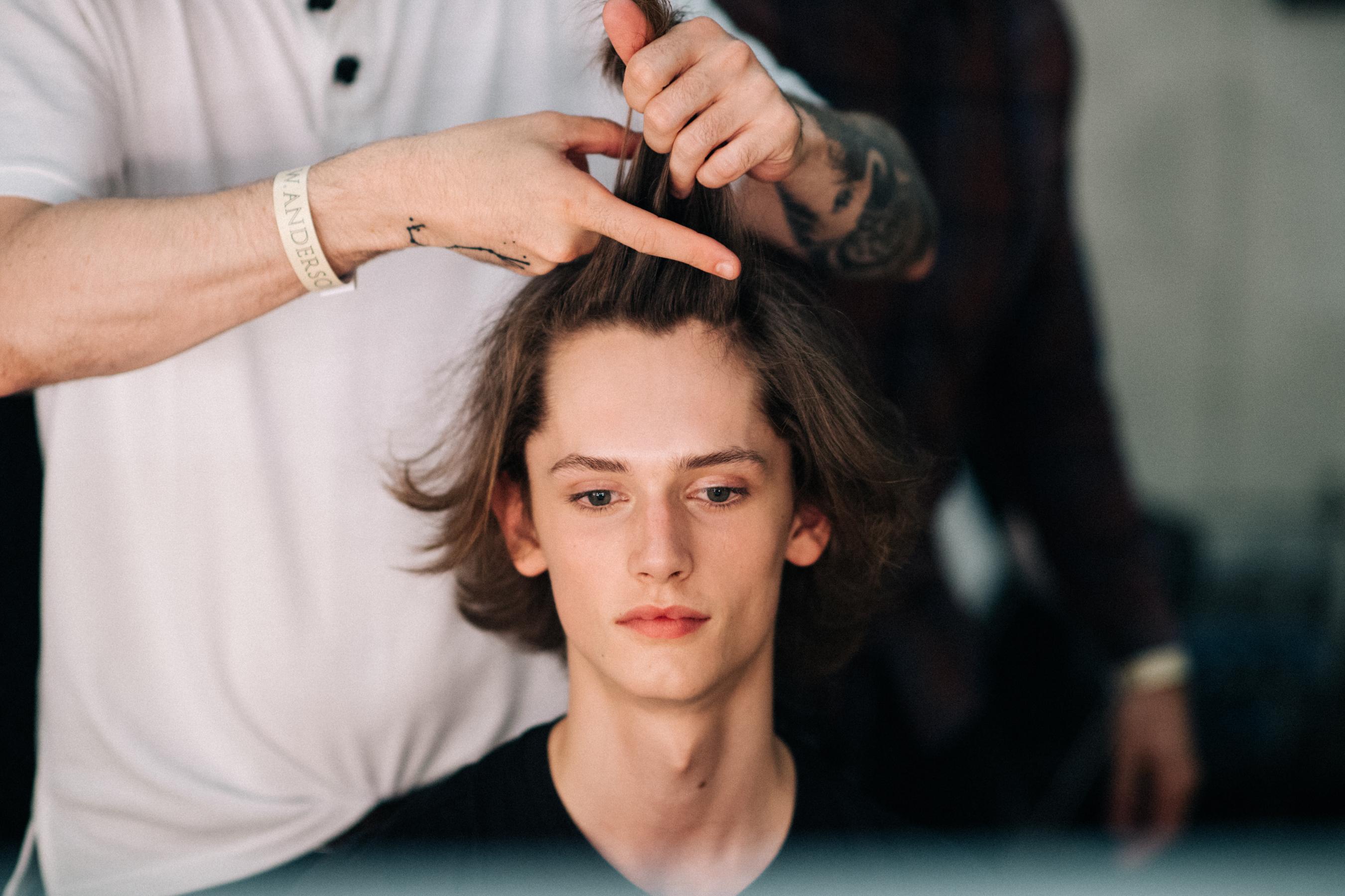 Male models getting his hair done