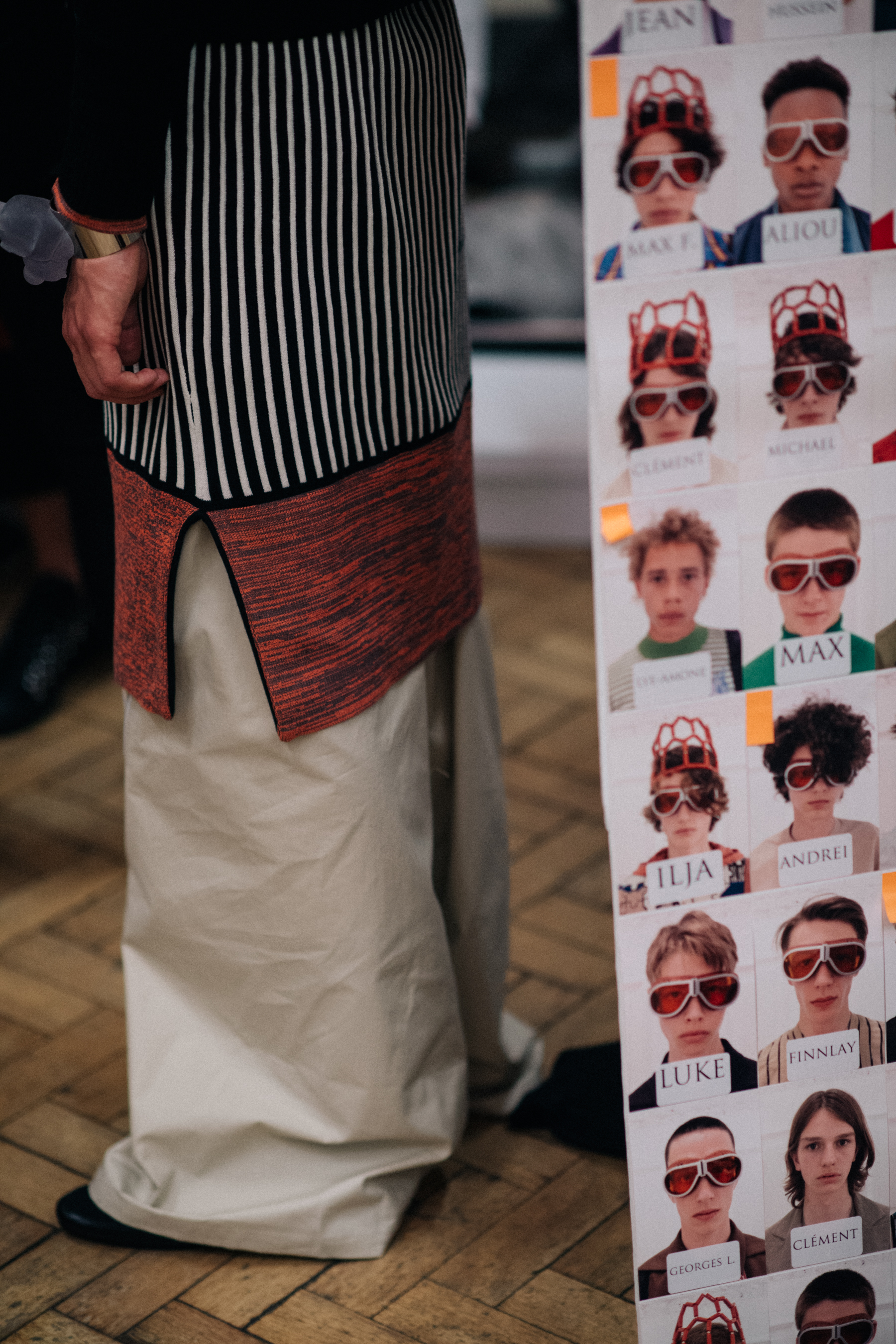 Long striped shirt over white trousers