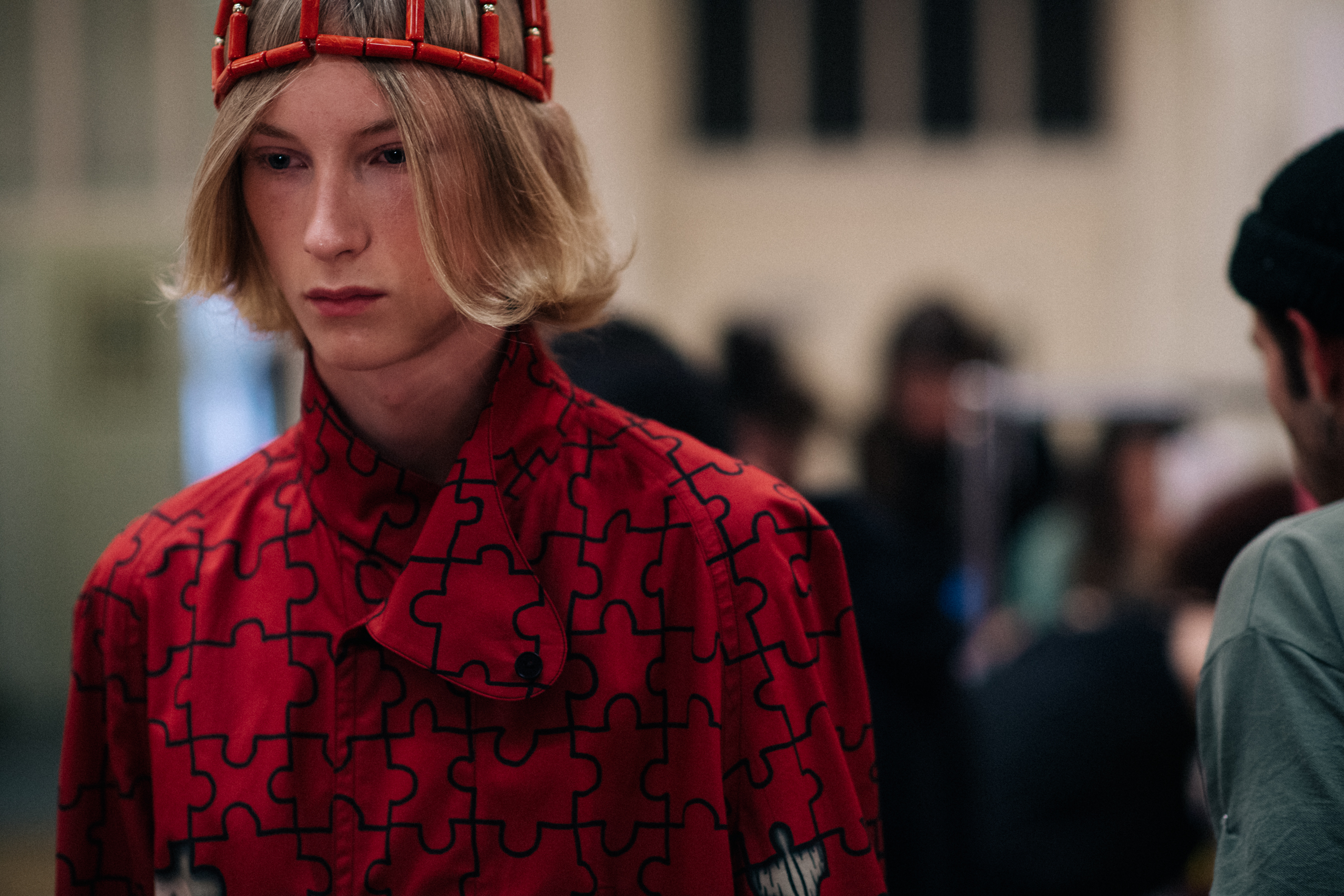 A man in a red printed jacket