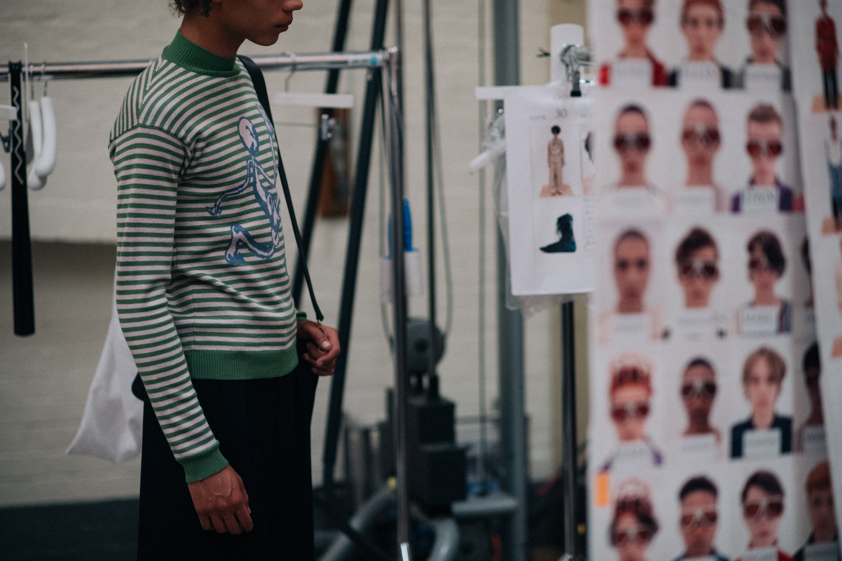 Model wearing a green striped longsleeve