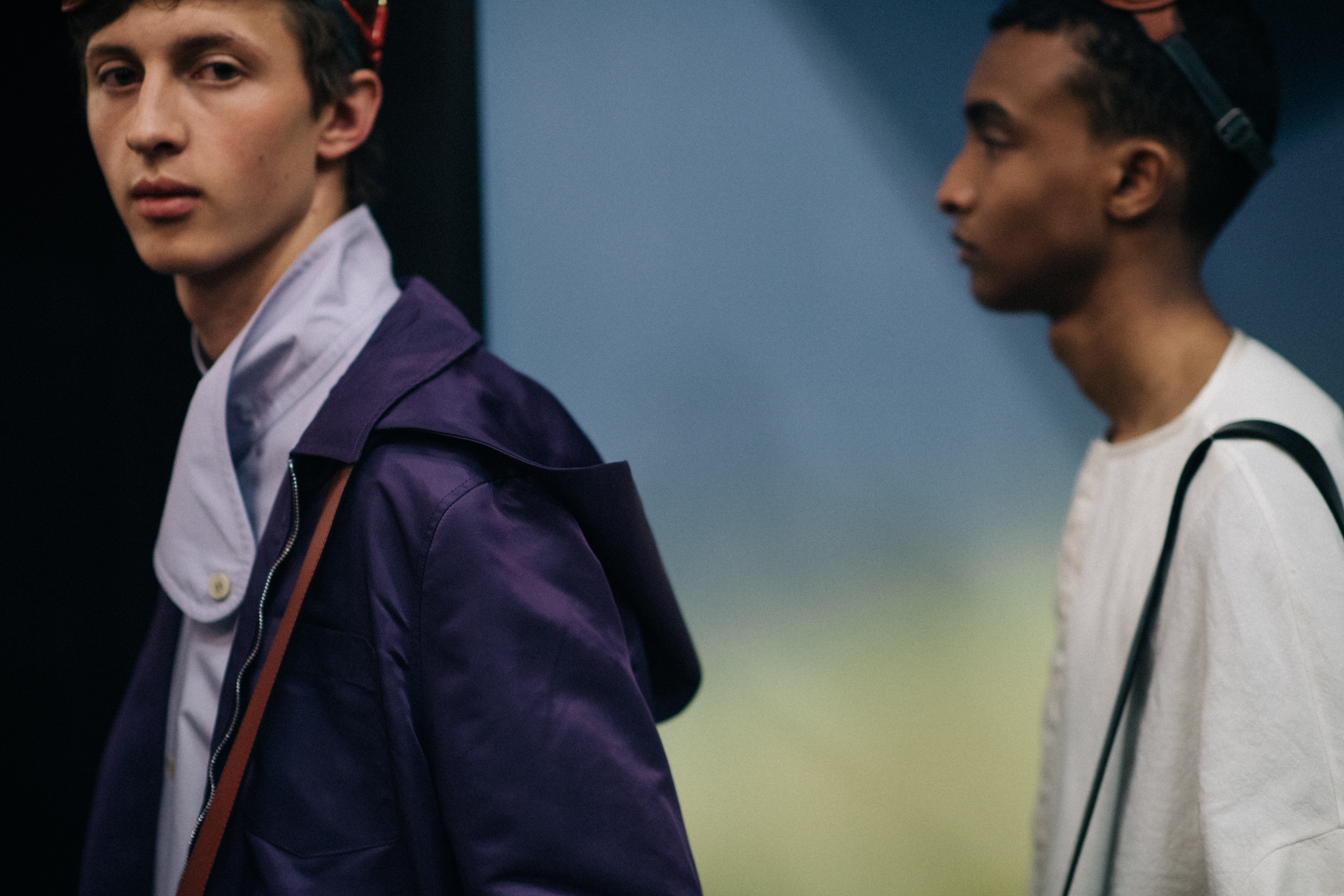 Two male models walking around