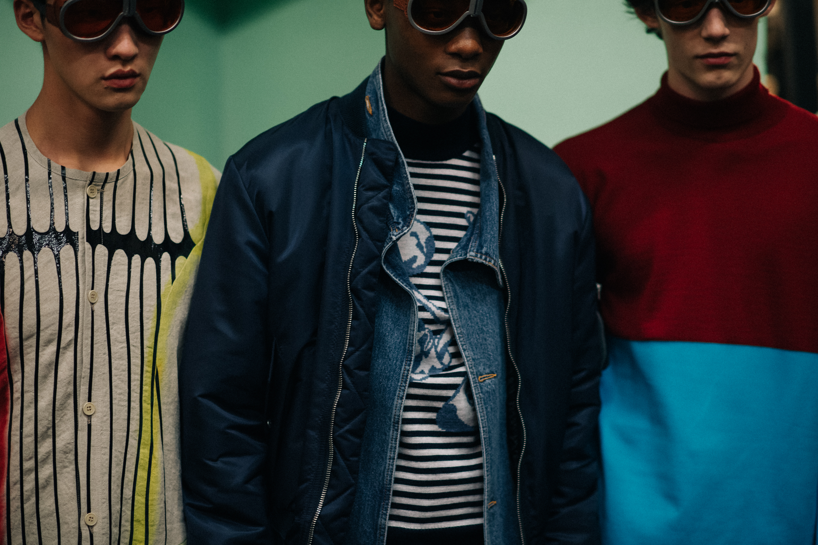 Models posing in colourful outfits
