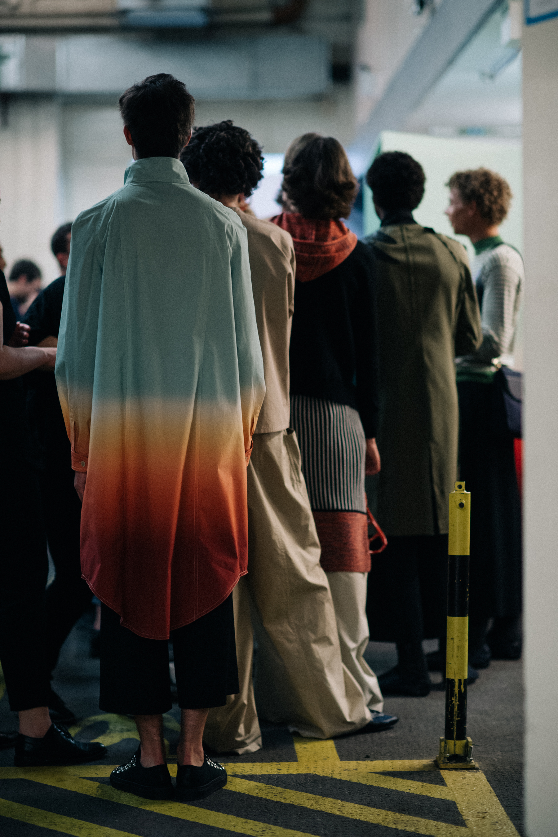 Male model in a long colourful coat
