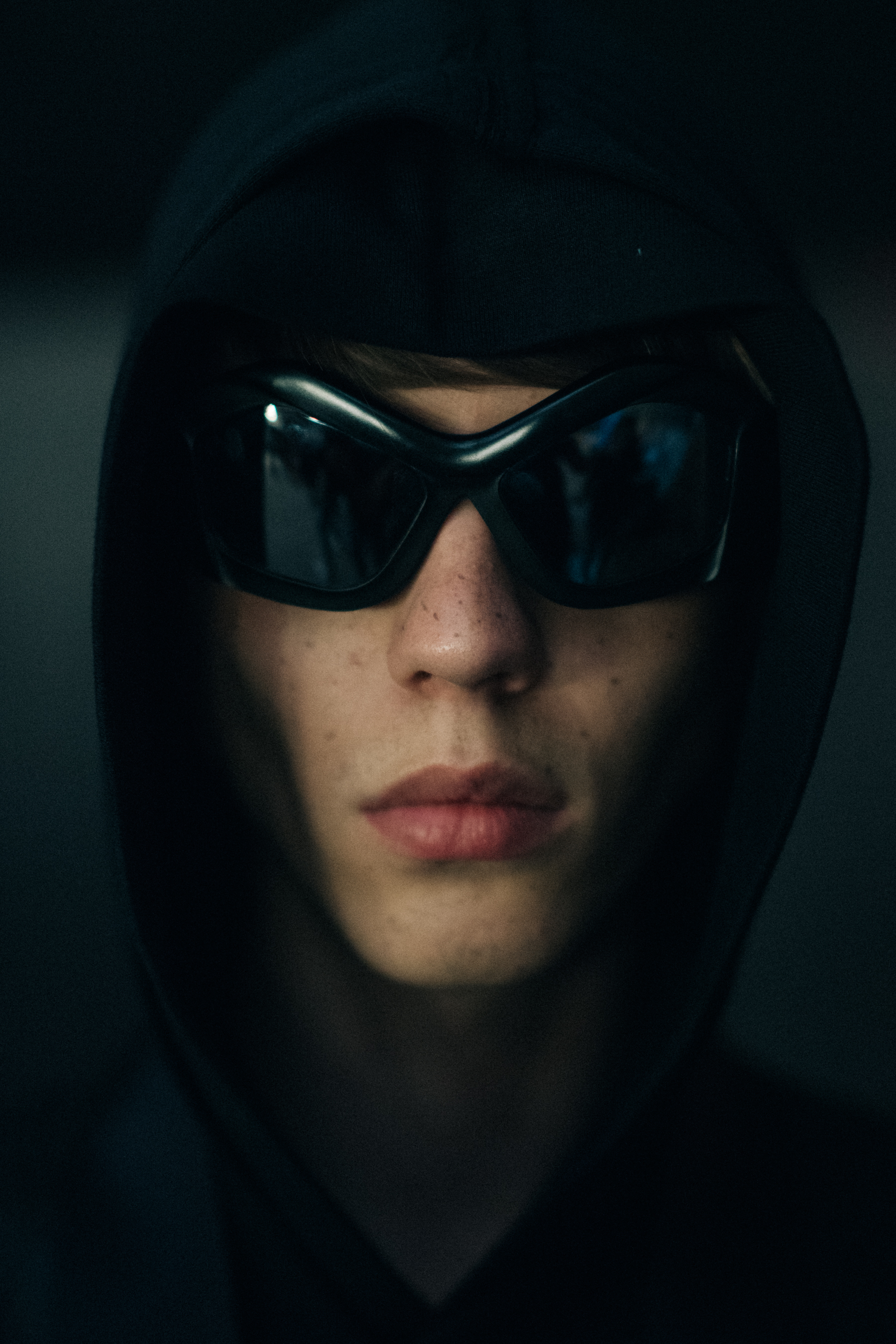 Portrait of a model in a black hoodie