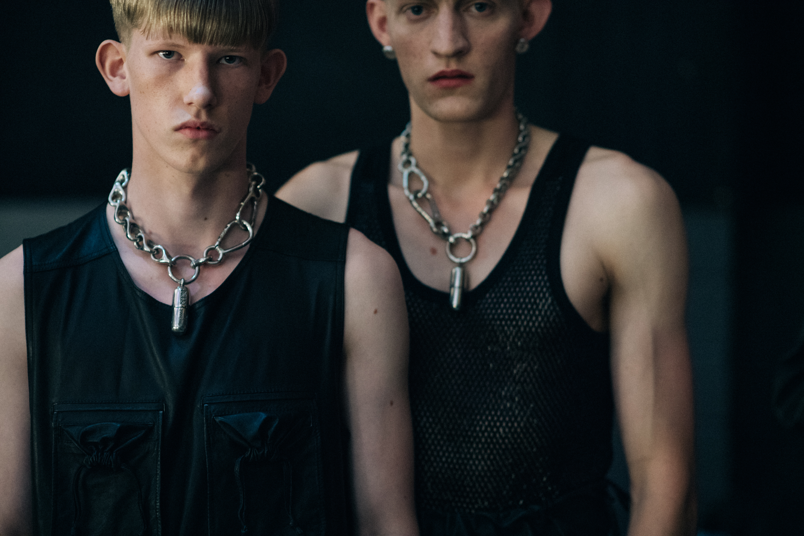 Male models in black tank tops