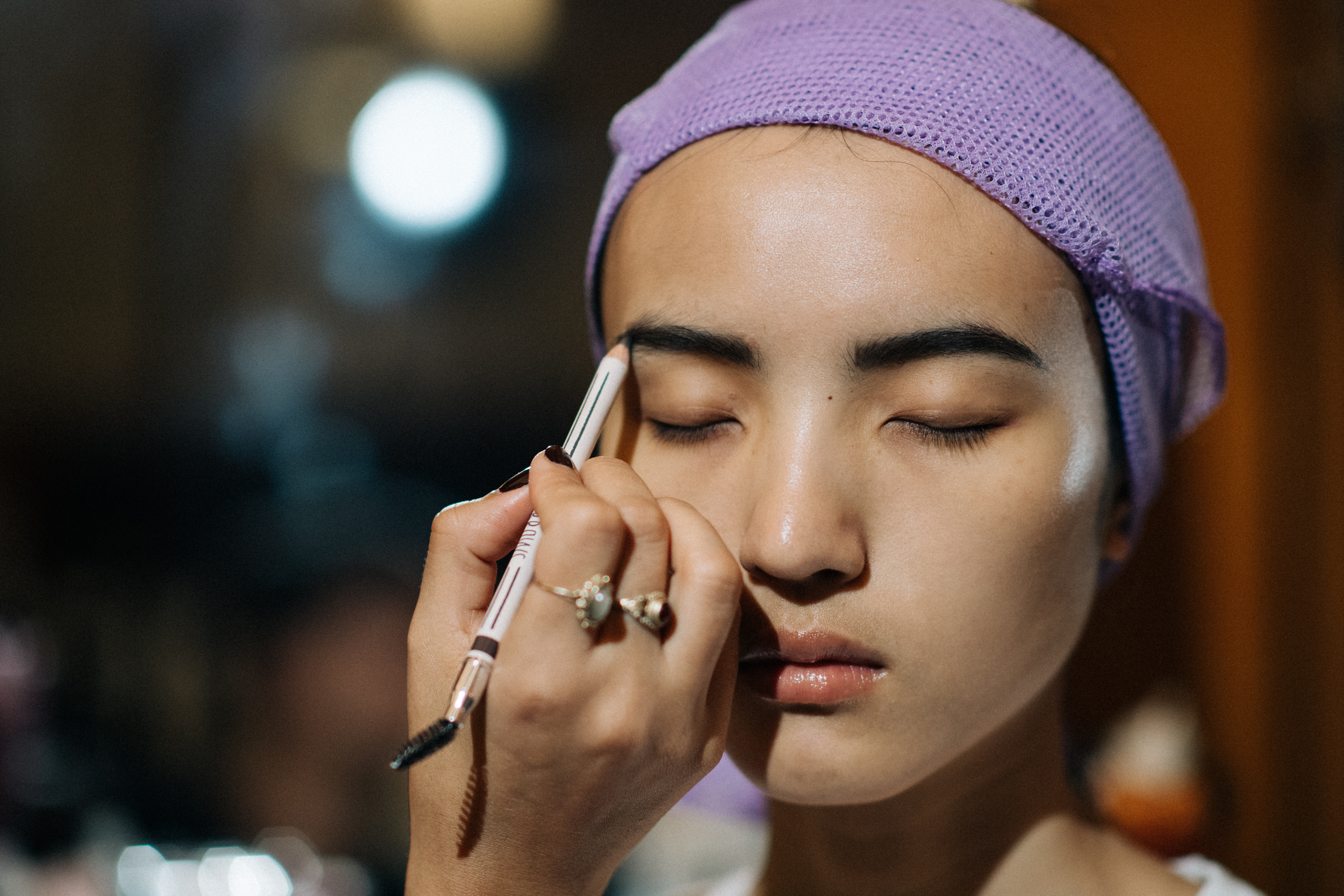 Female model getting make-up done