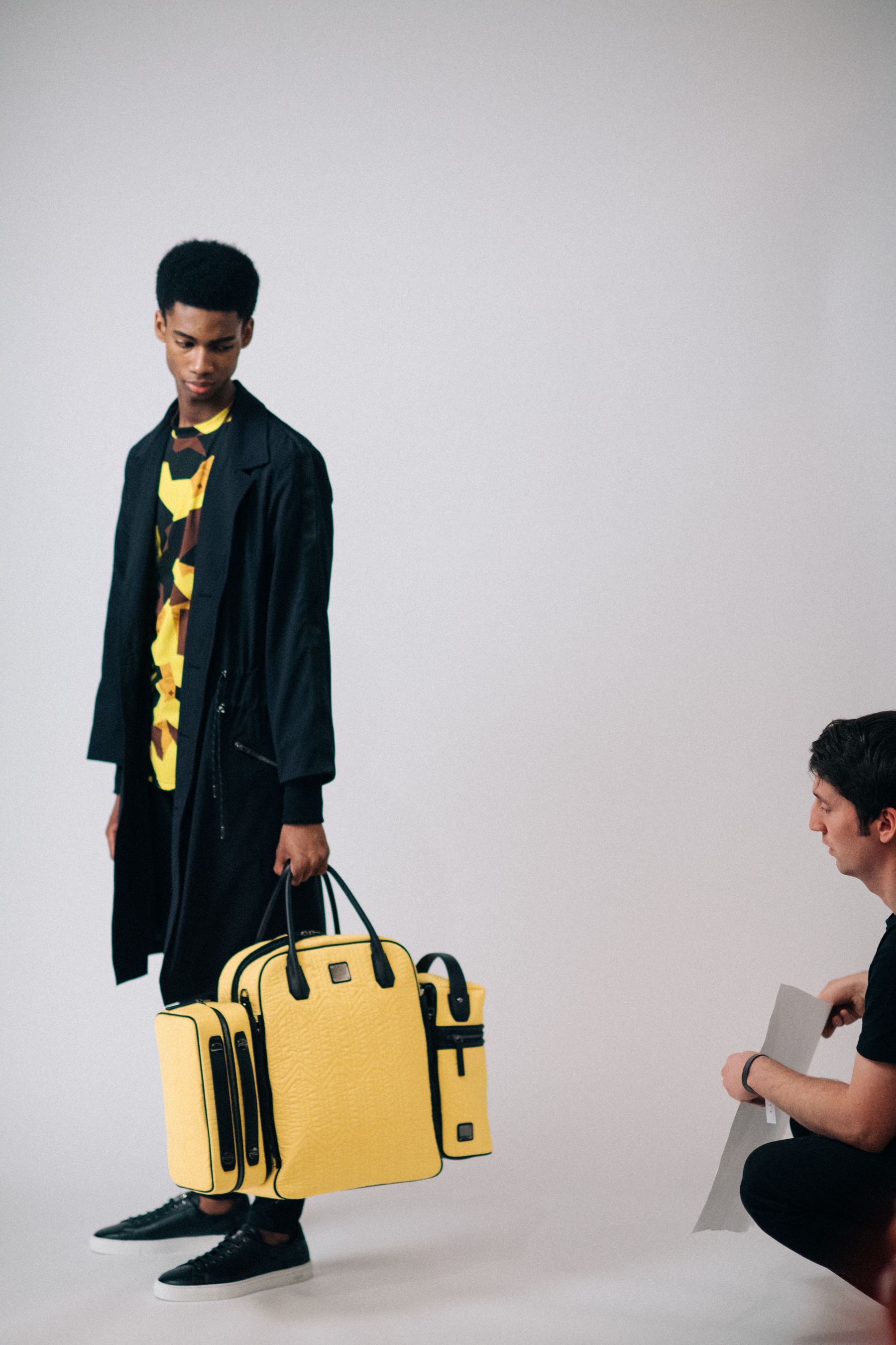 Male model with a yellow bag