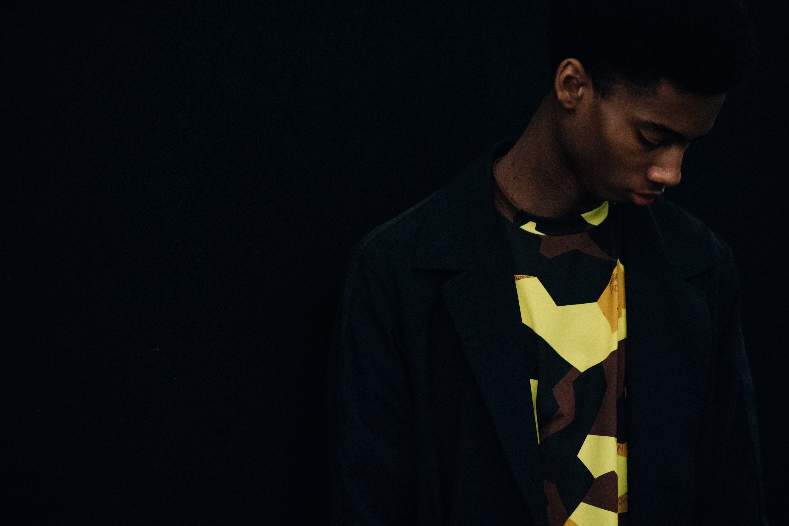 Model wearing yellow printed sweater