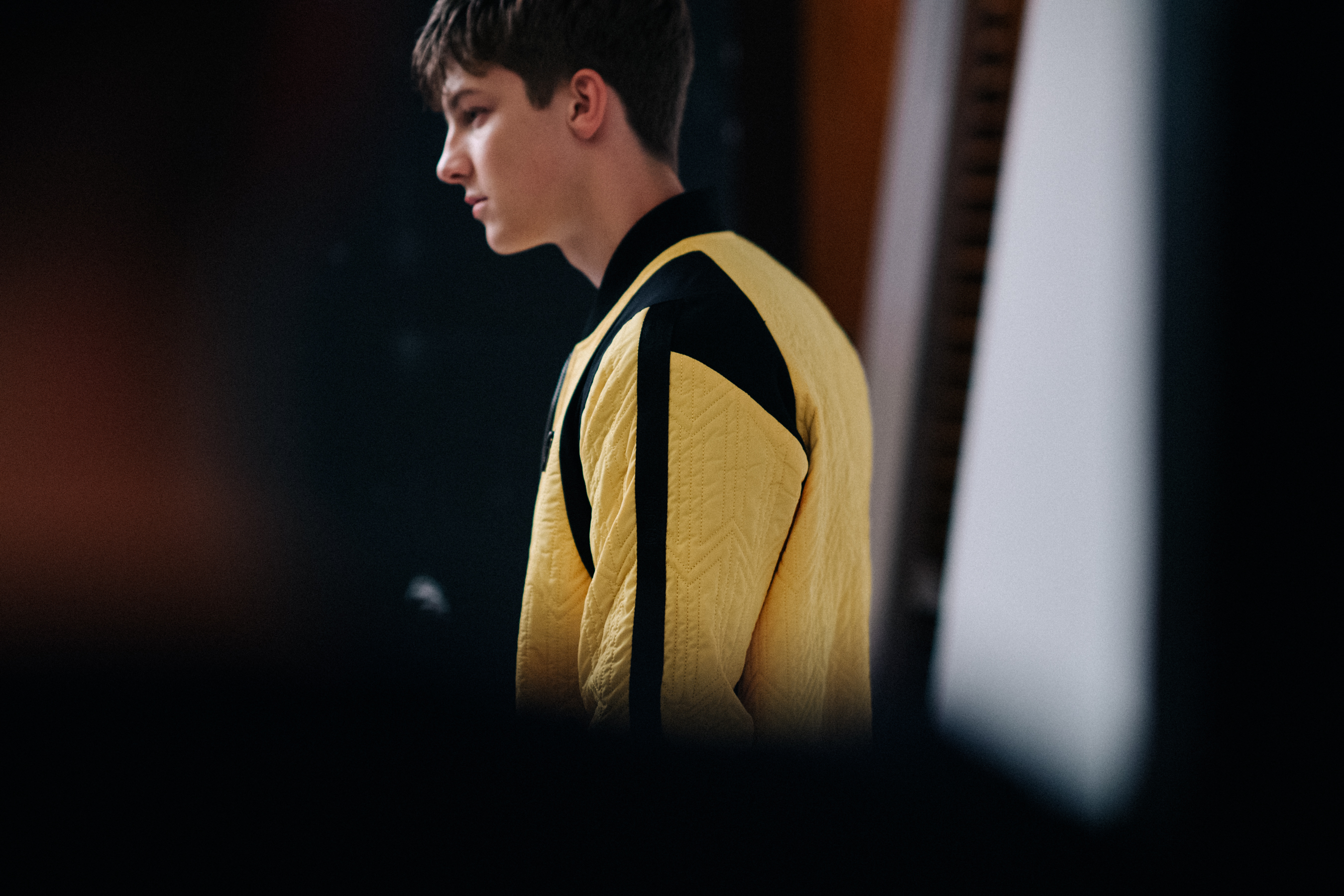 Model in a yellow jacket posing