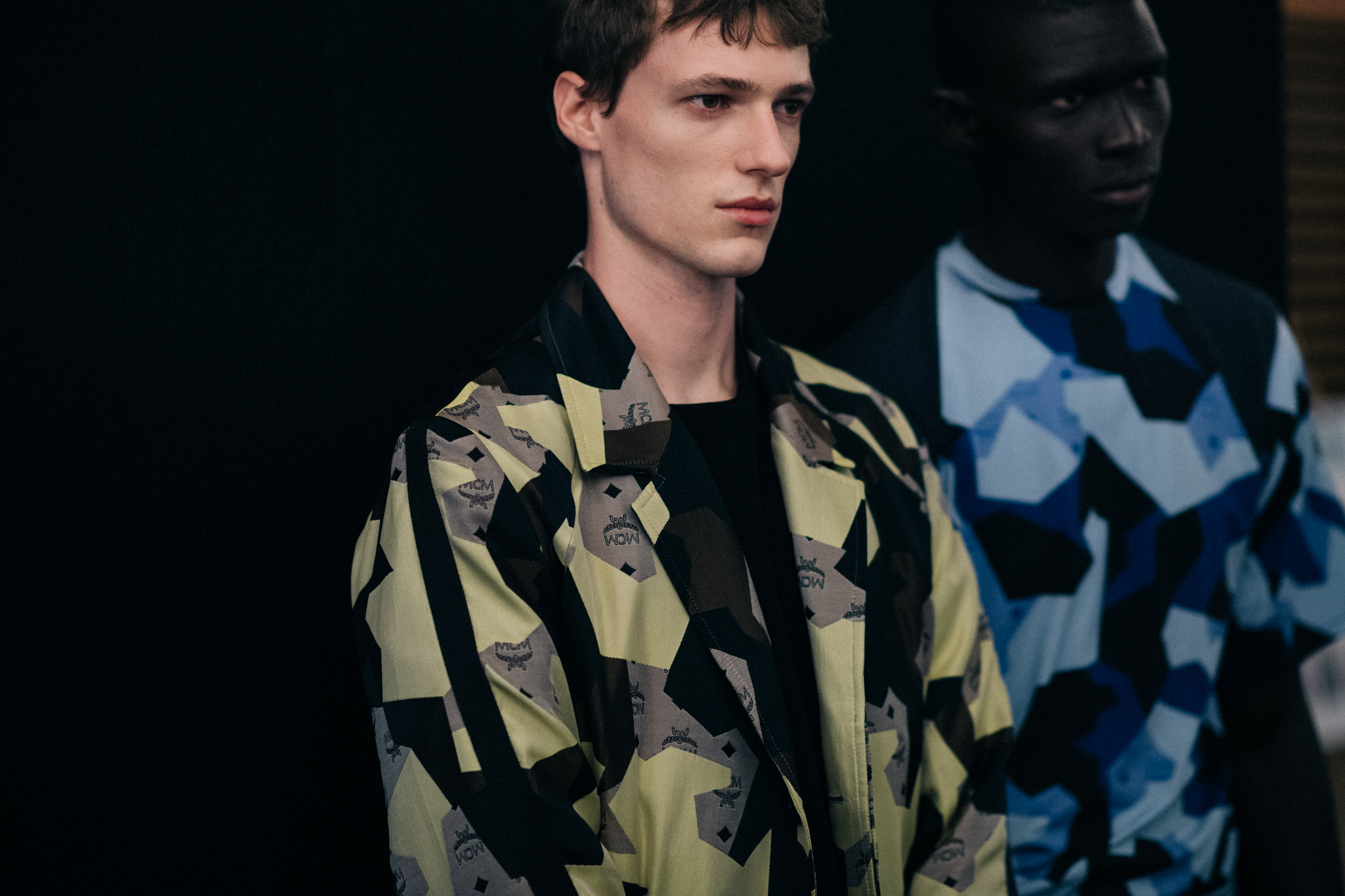 Two male models posing together