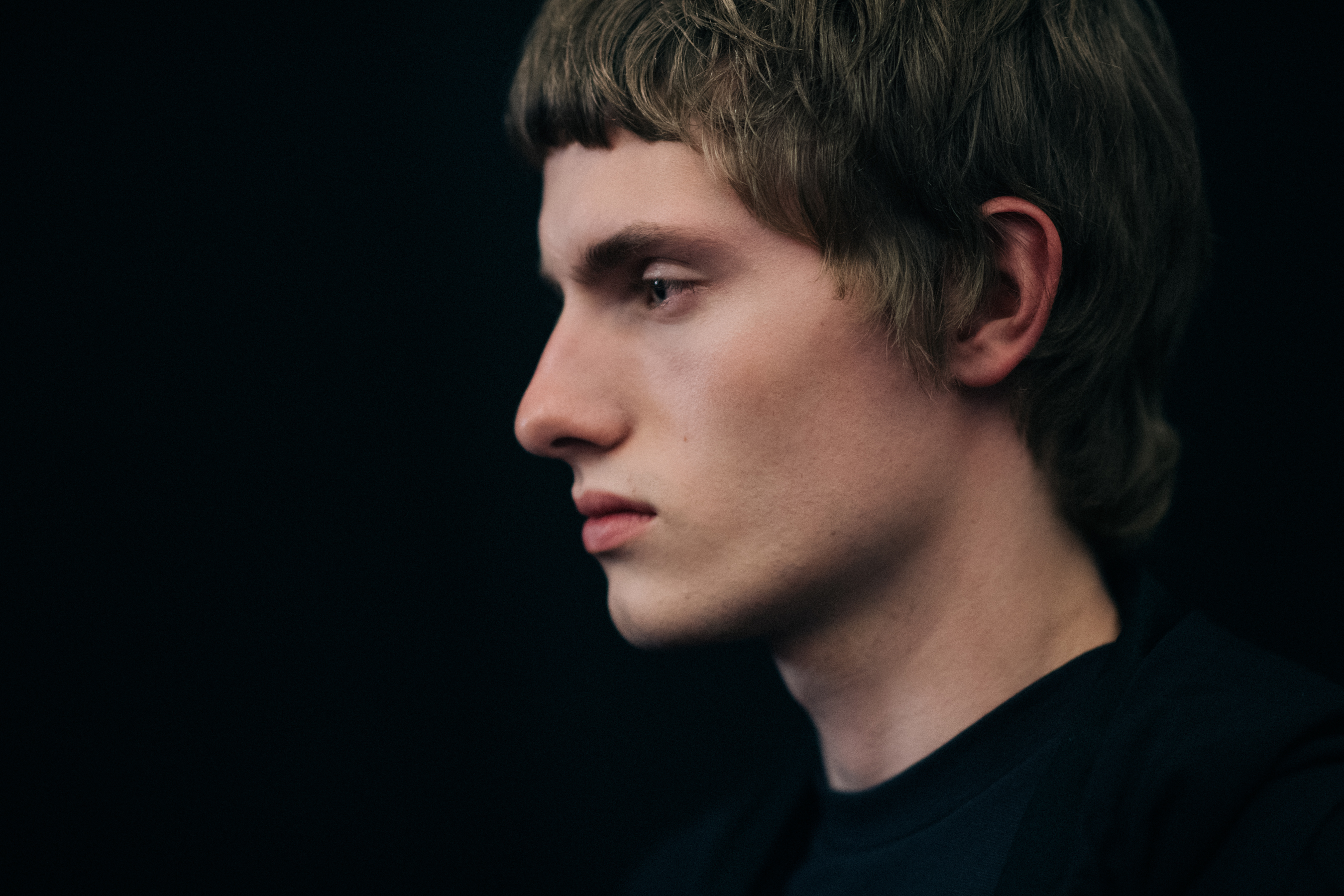 Blond male model being photographed