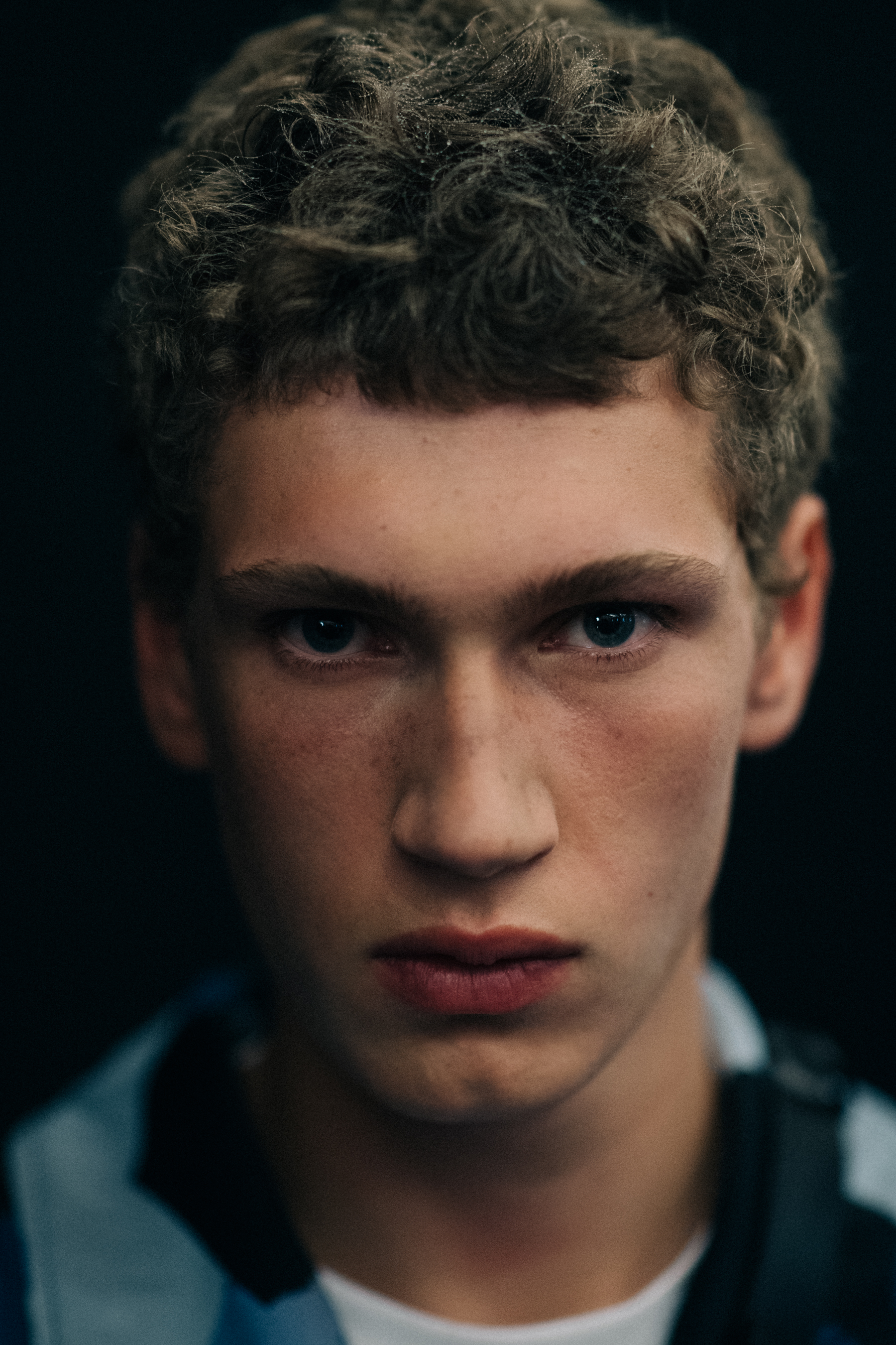 Male model with short curly hair