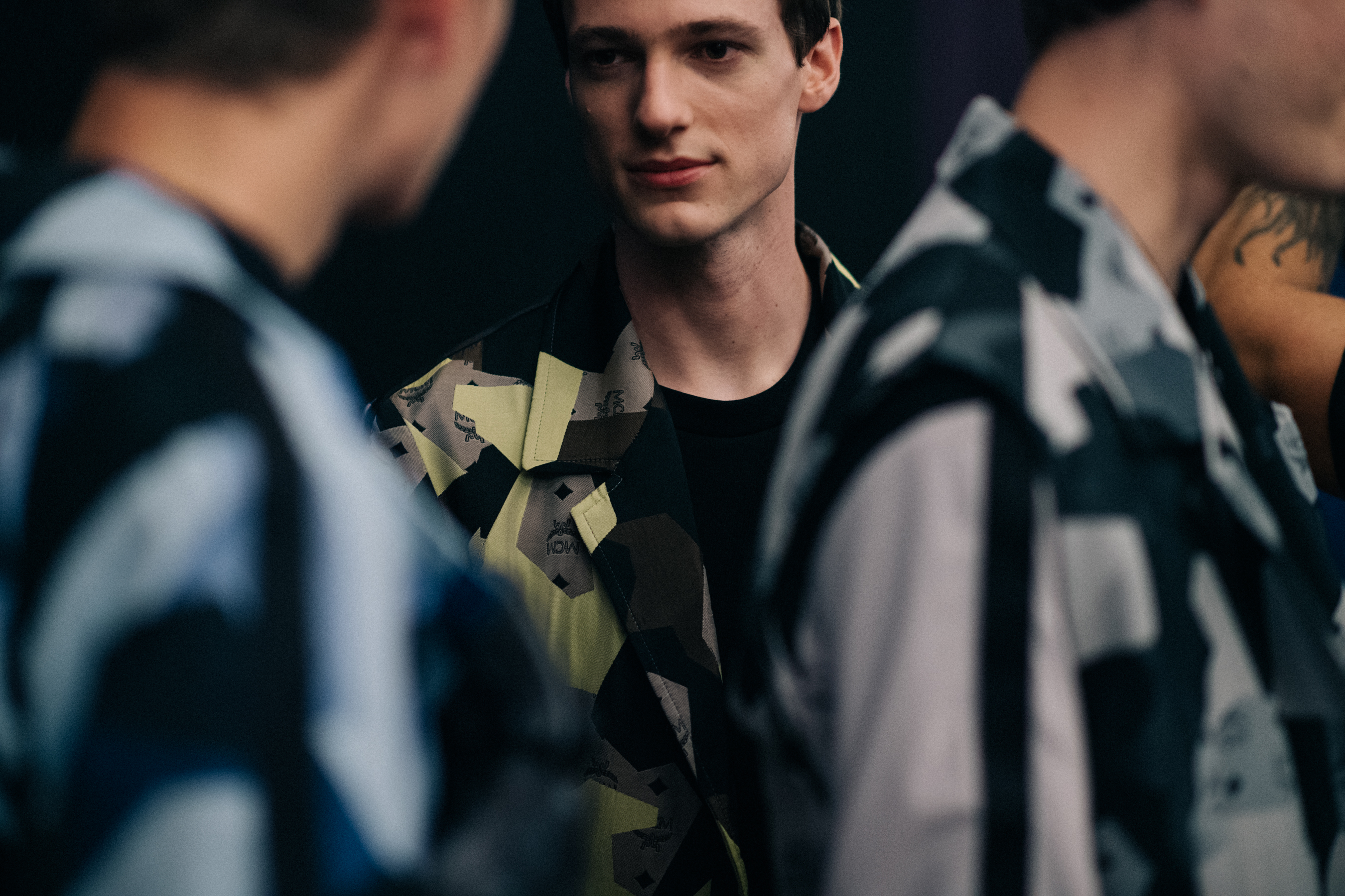 Male models chatting before the show