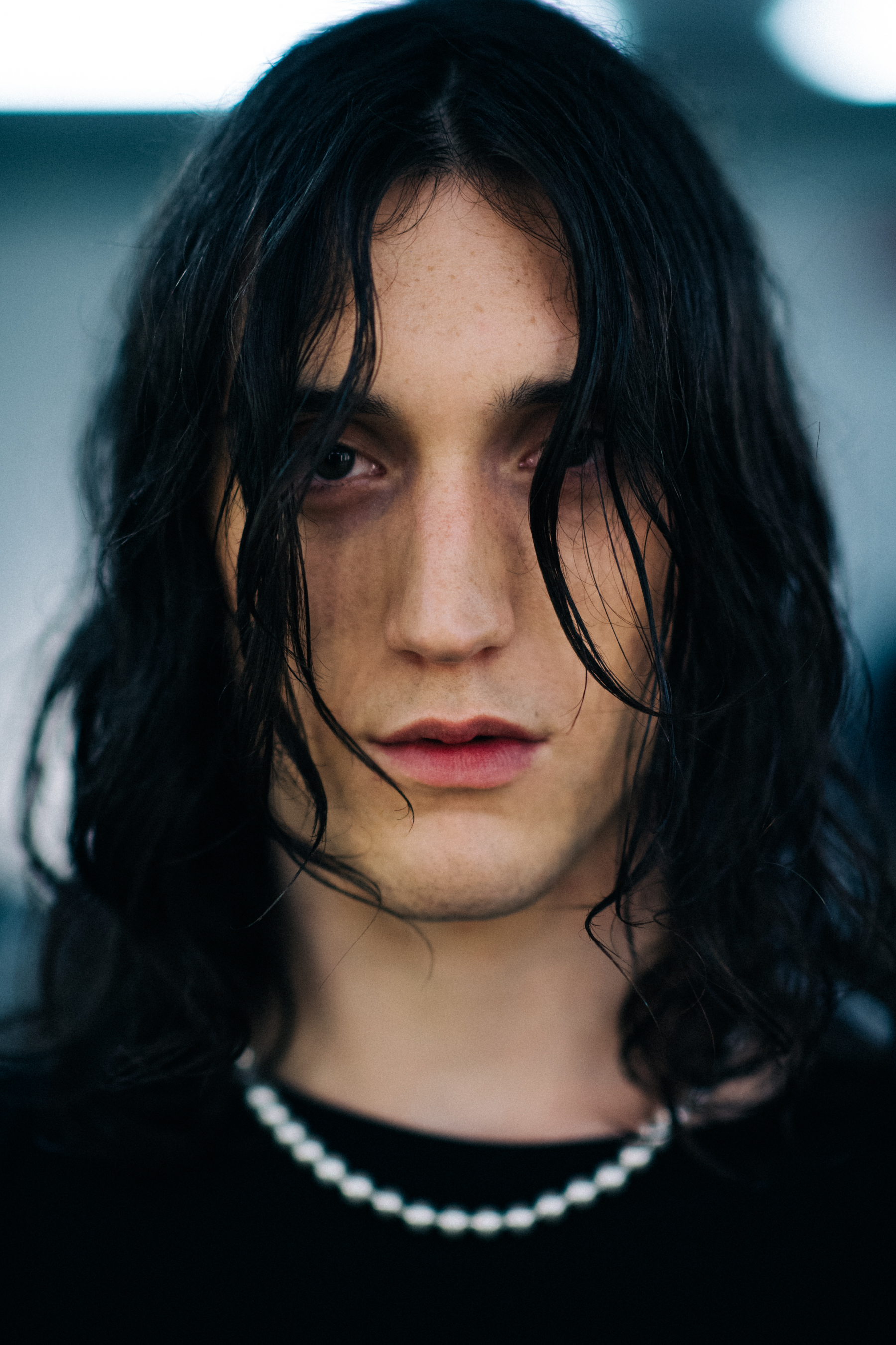 A model with long dark hair