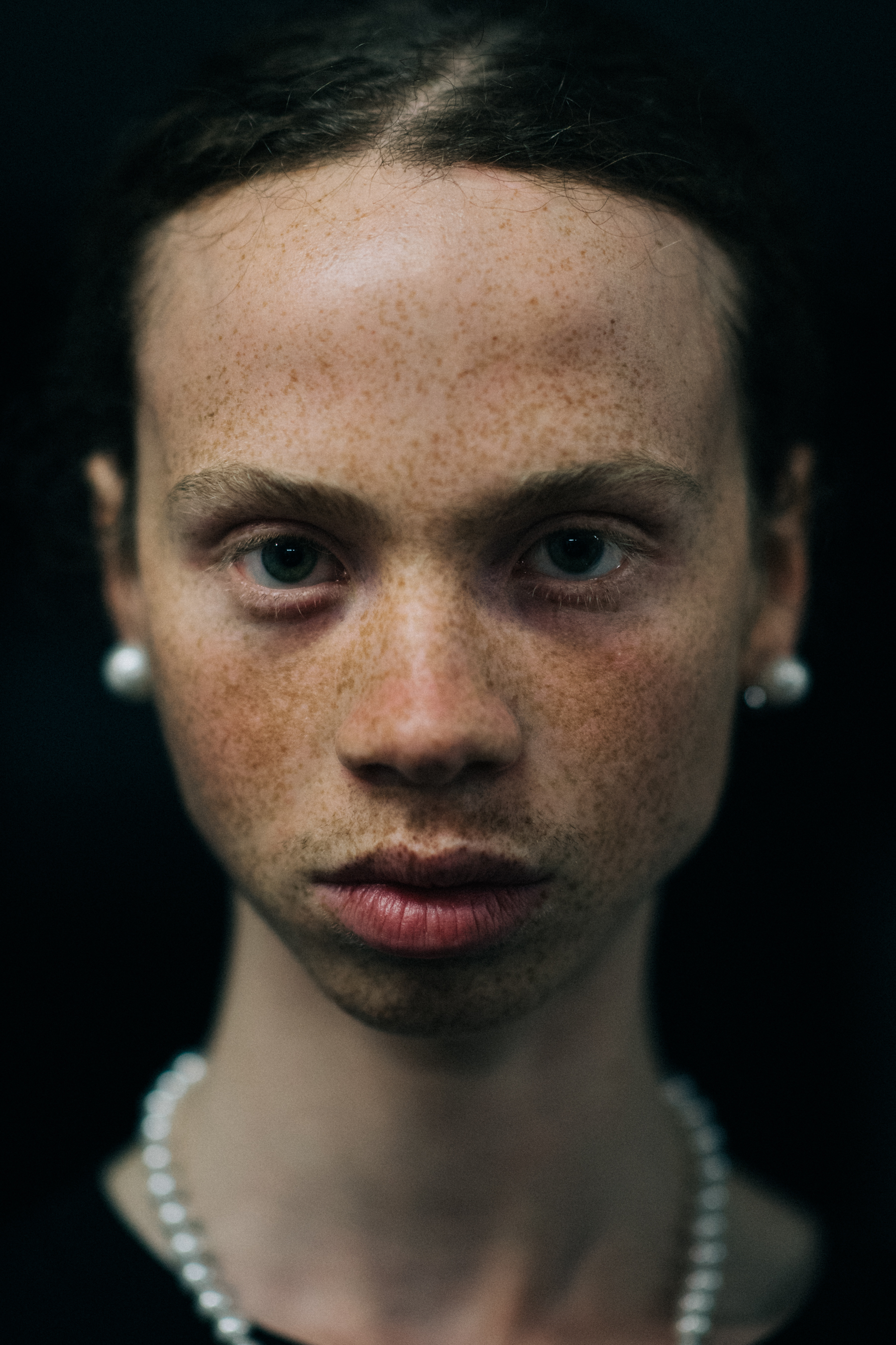 A male model with freckles
