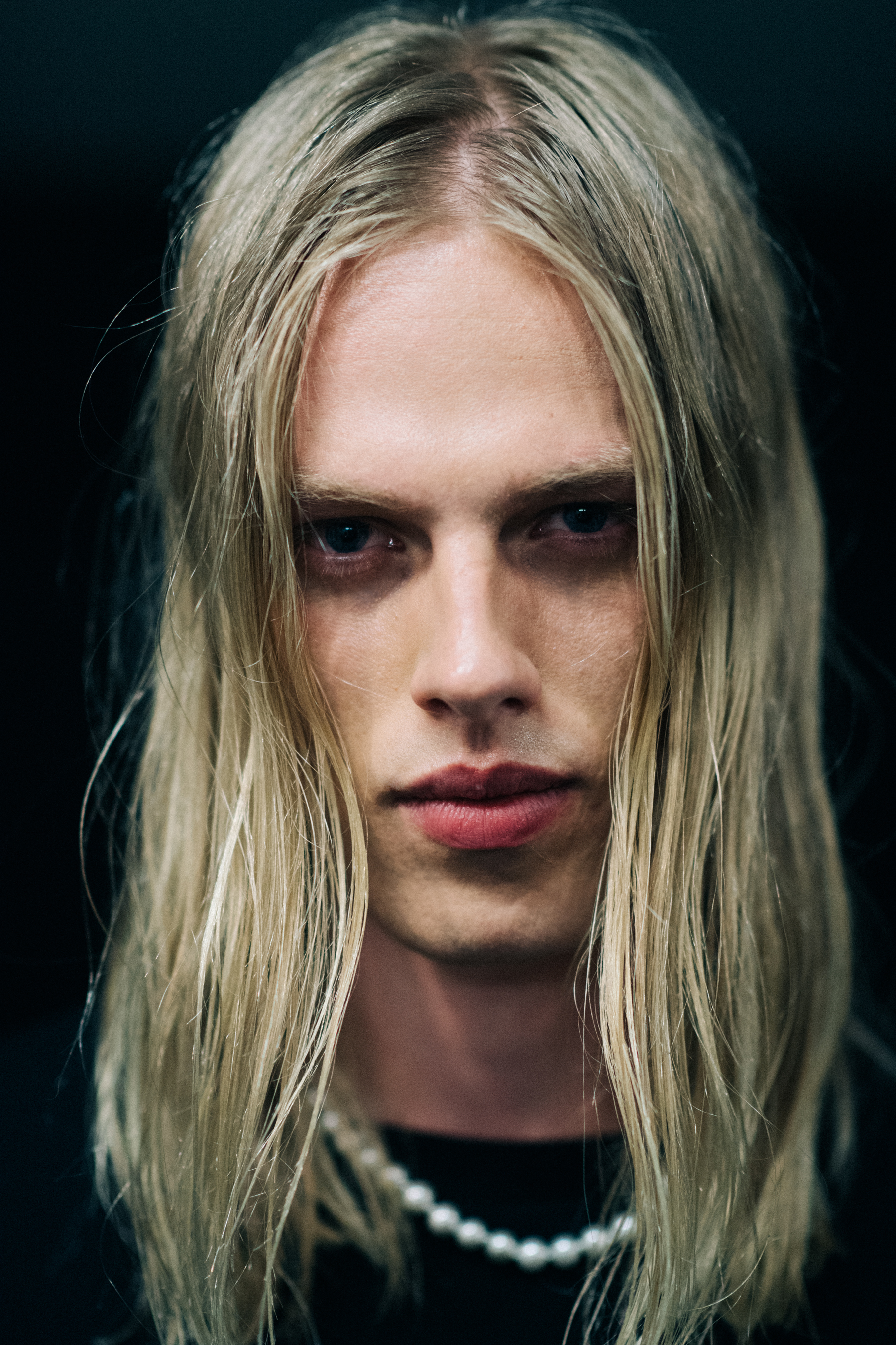 A male model with long blond hair