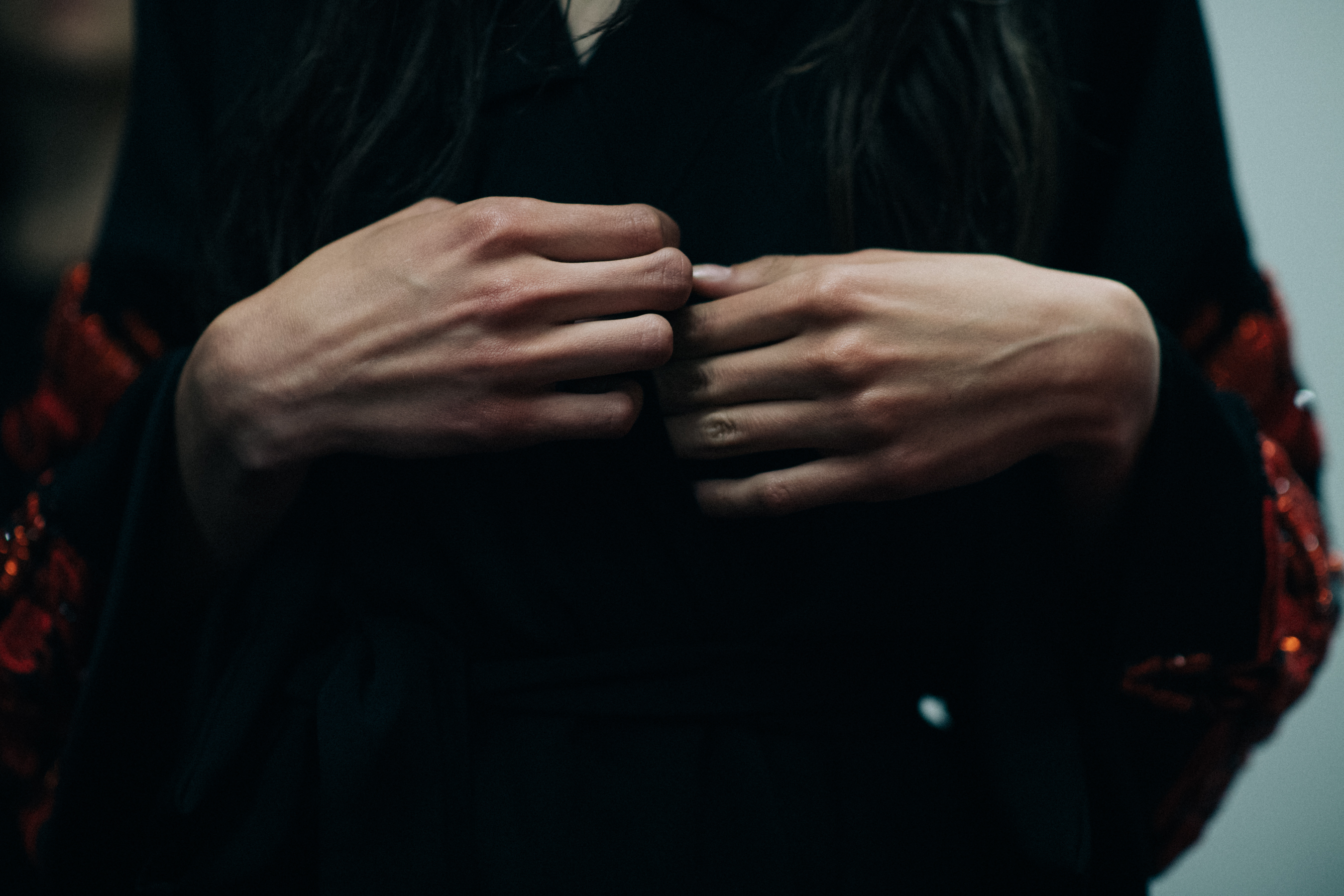 Hands of a model backstage