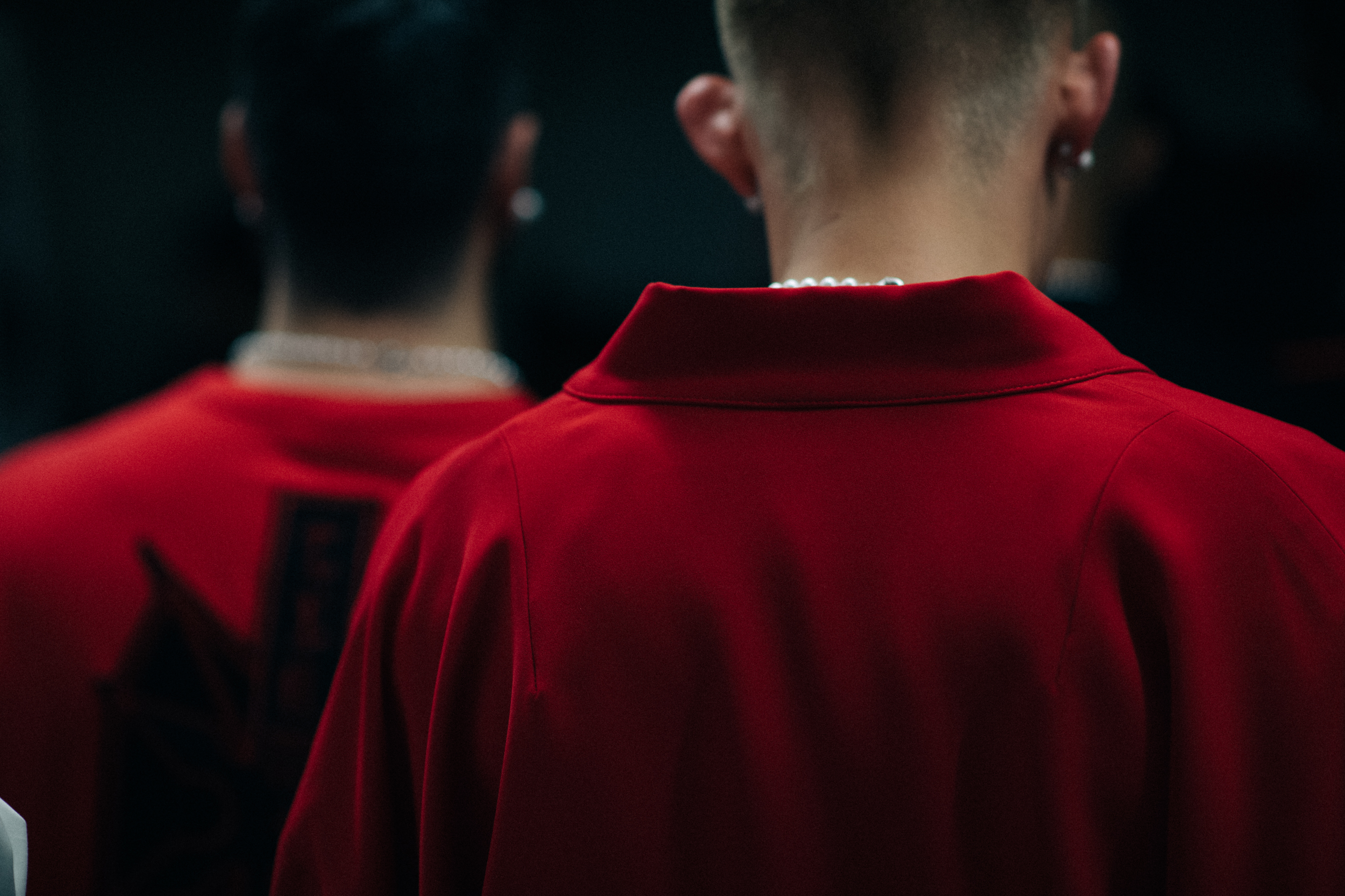 Models wearing red sweatshirts