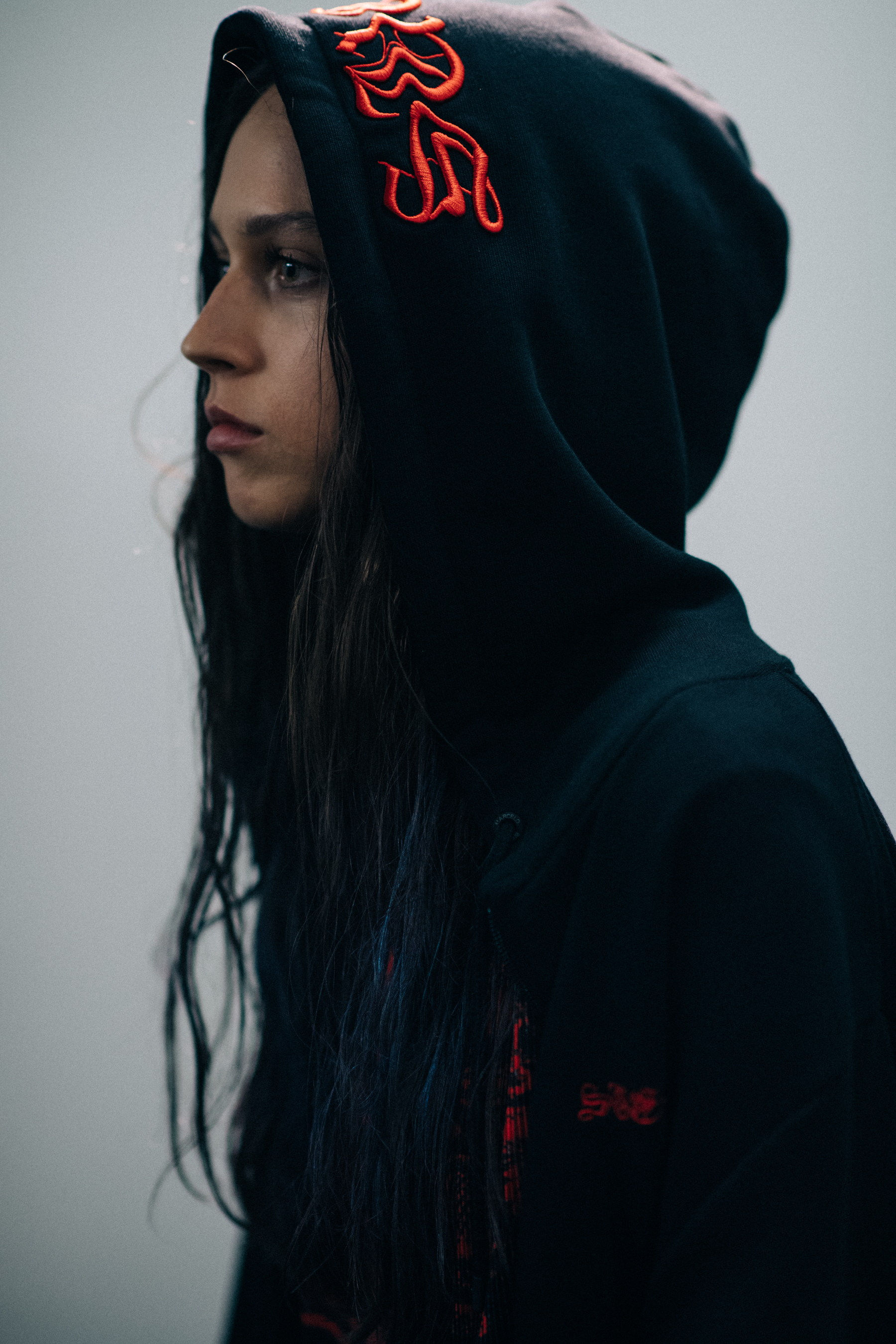 A girl wearing a black sweatshirt