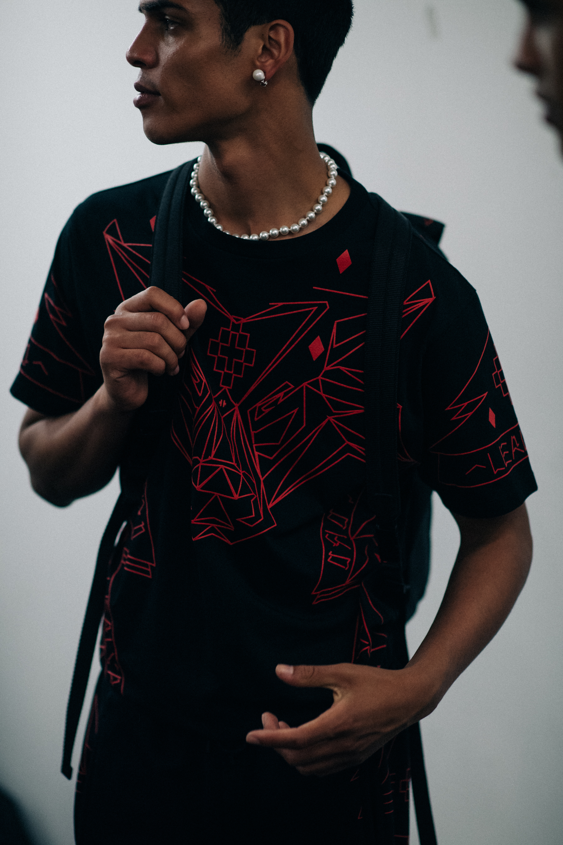 A man wearing a black T-Shirt