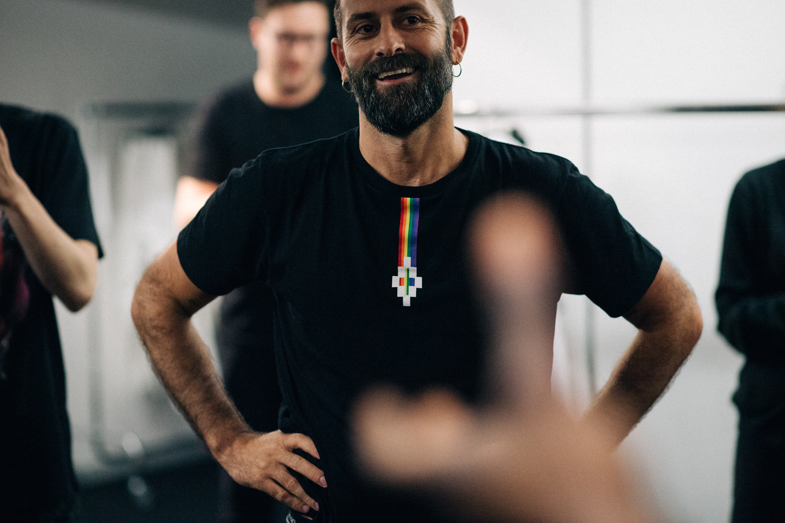 The designer smiling backstage
