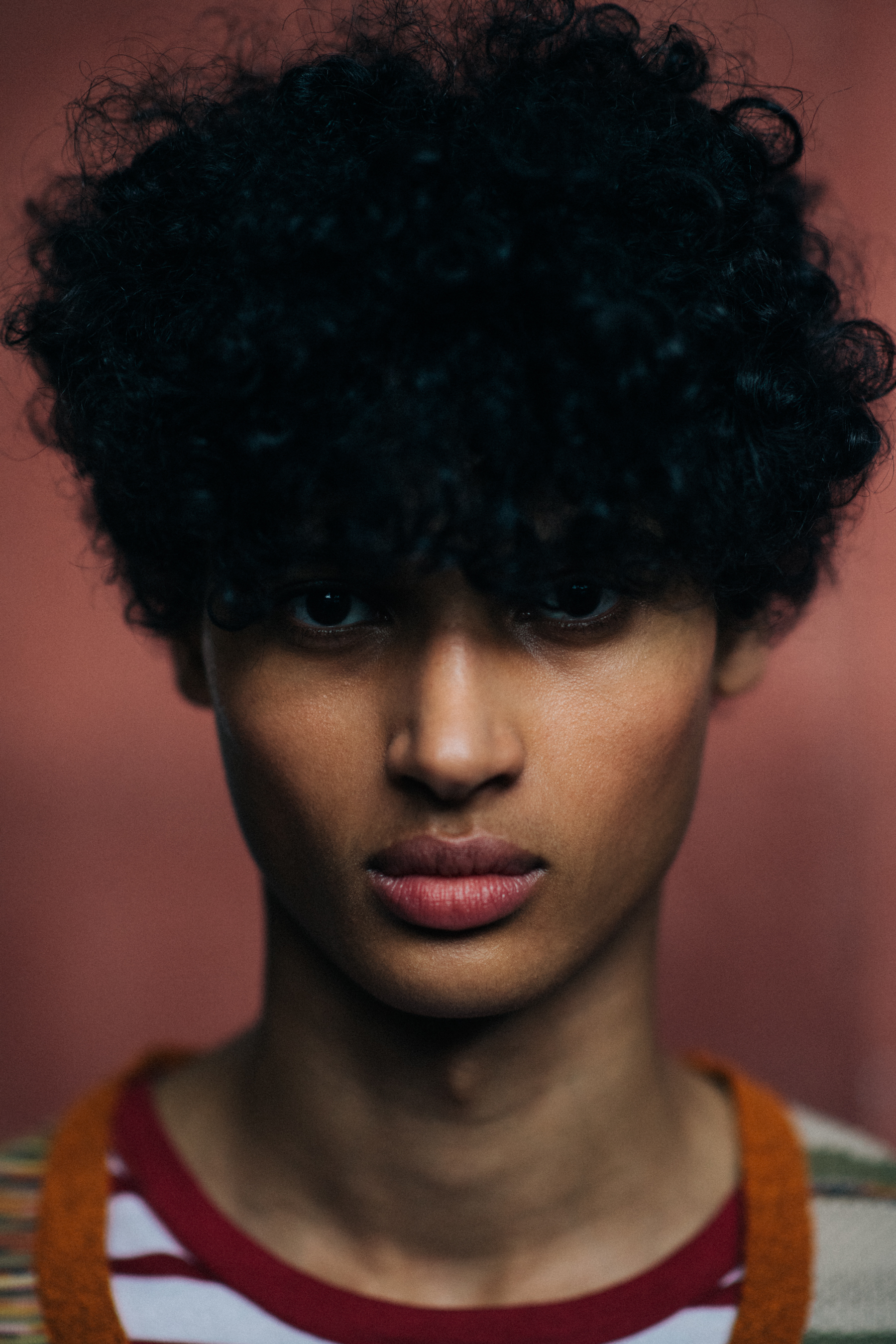 A young model with curly hair