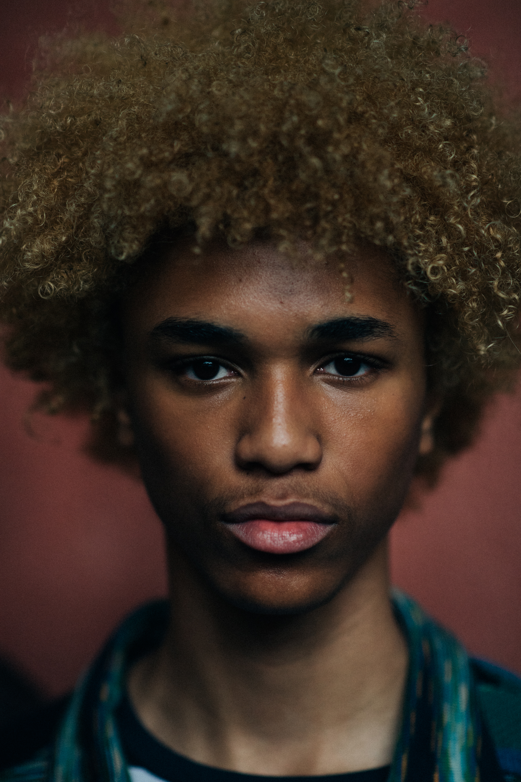 A male model with curly hair