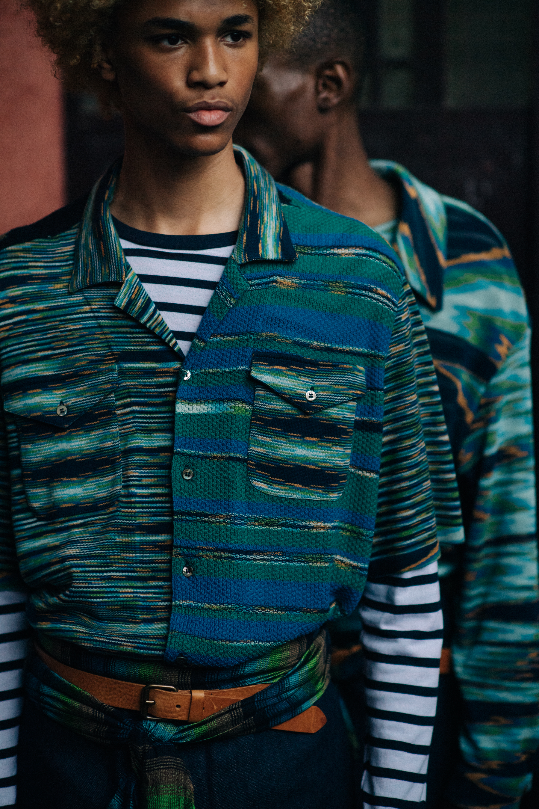 Male models earing green shirts