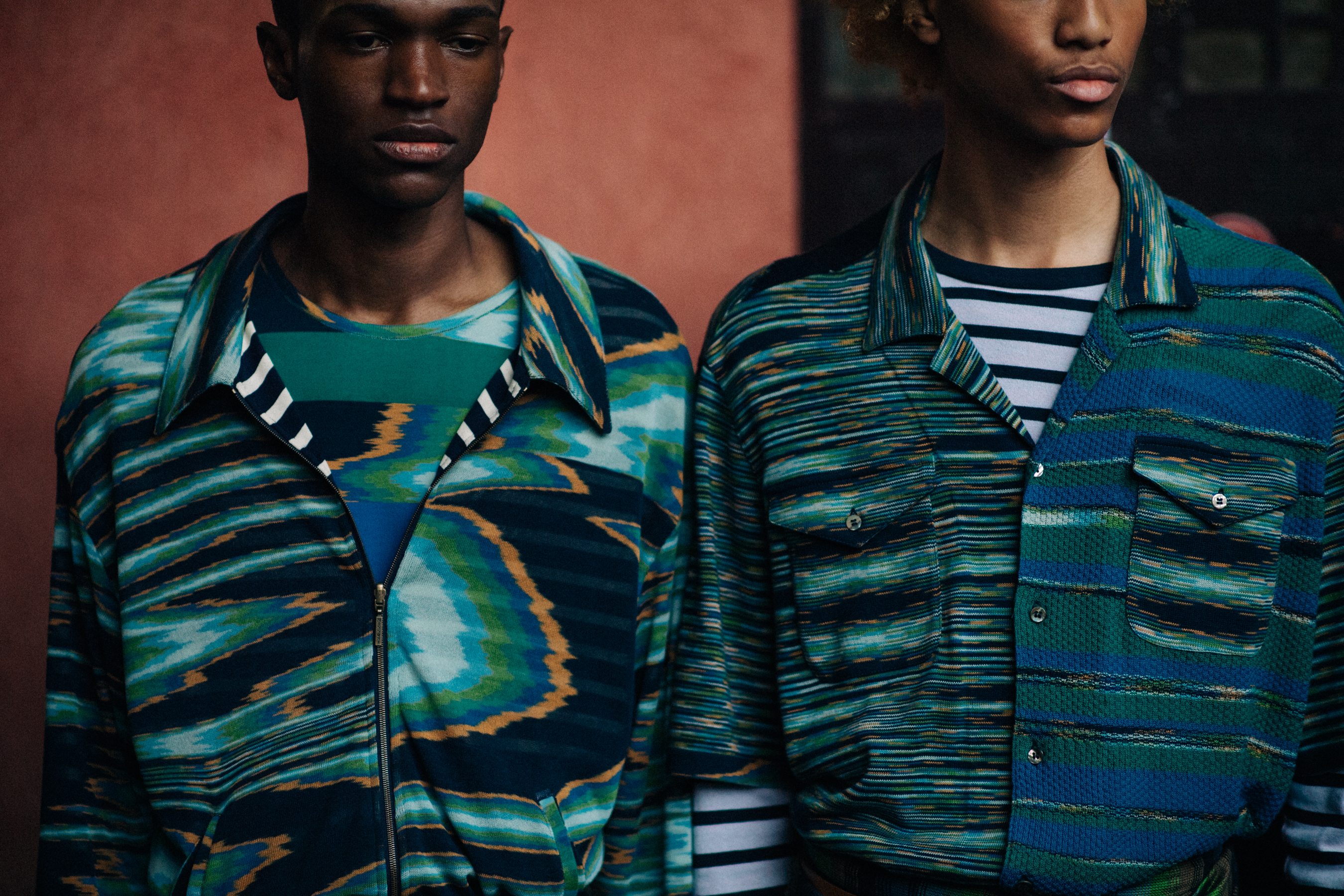 Men in green shirts with patterns