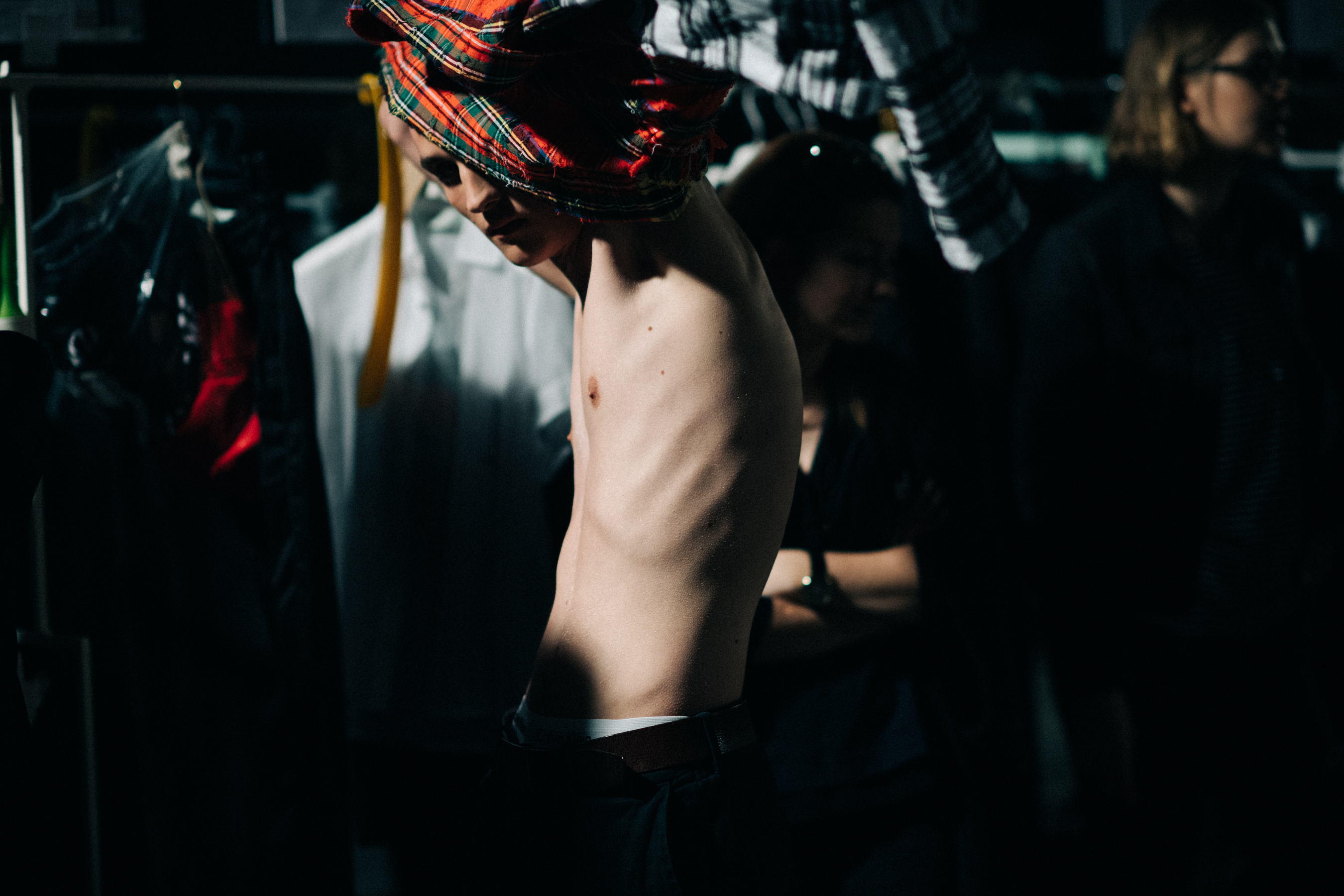 Male model getting dressed