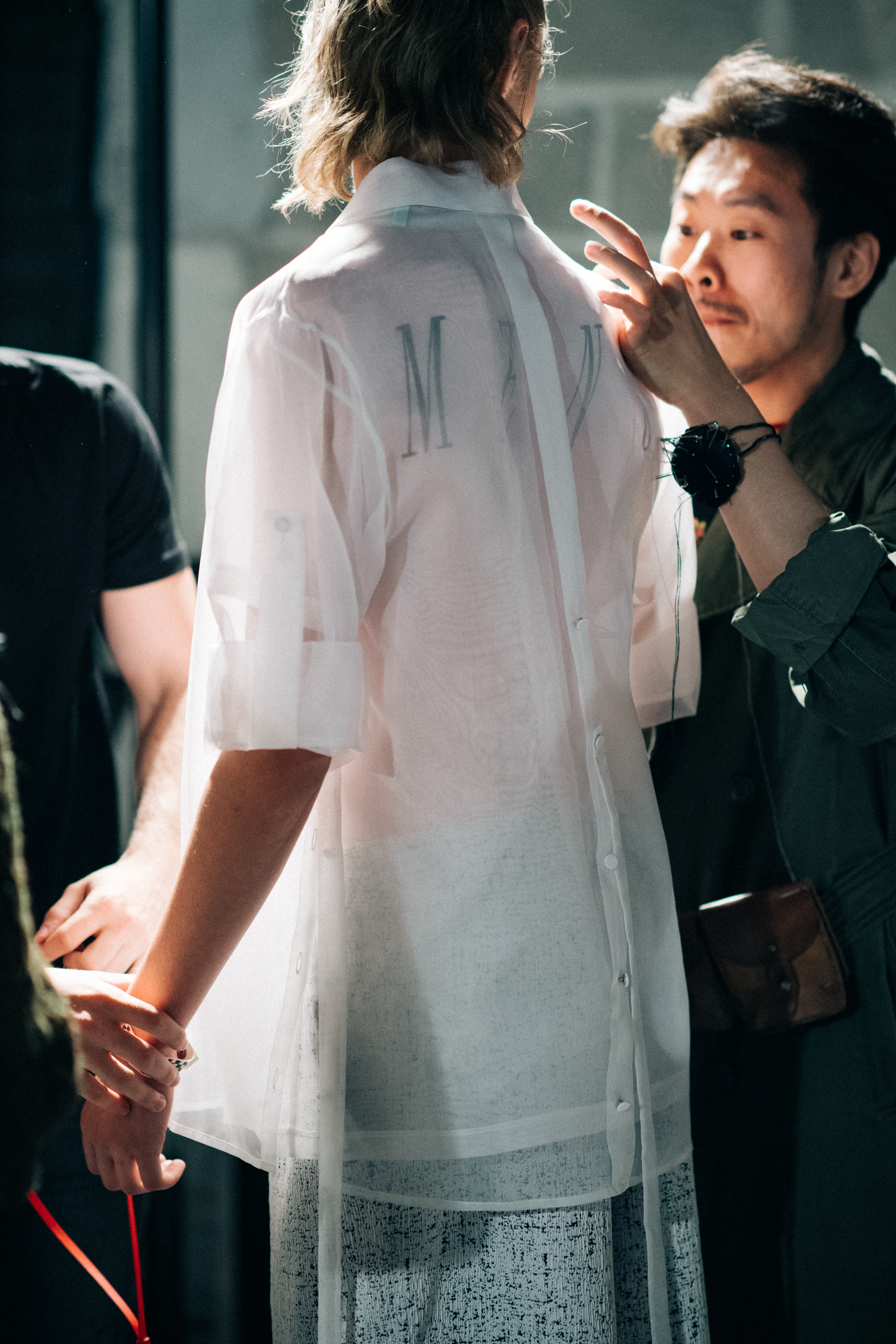Model wearing white long outfit