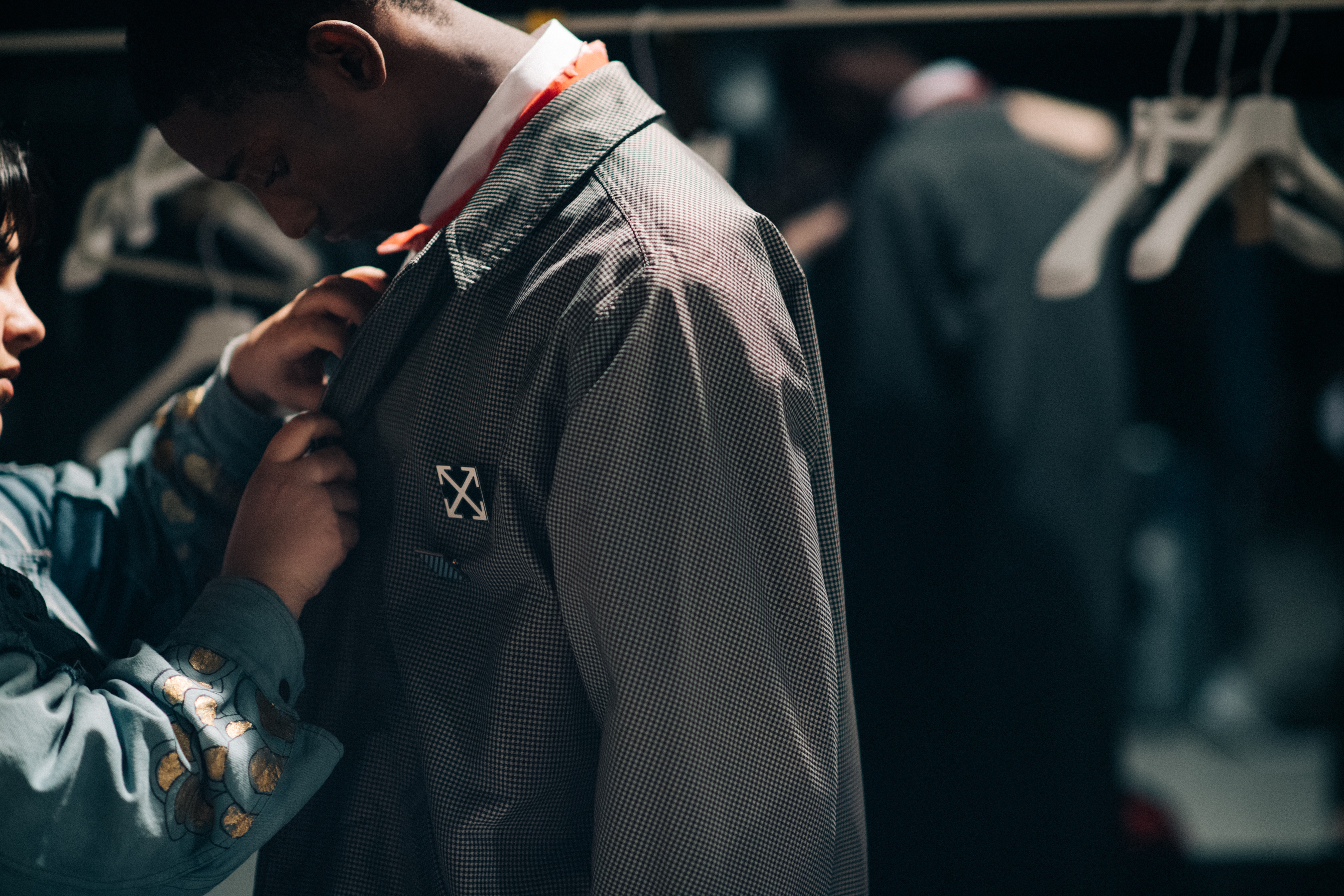 Male model getting dressed