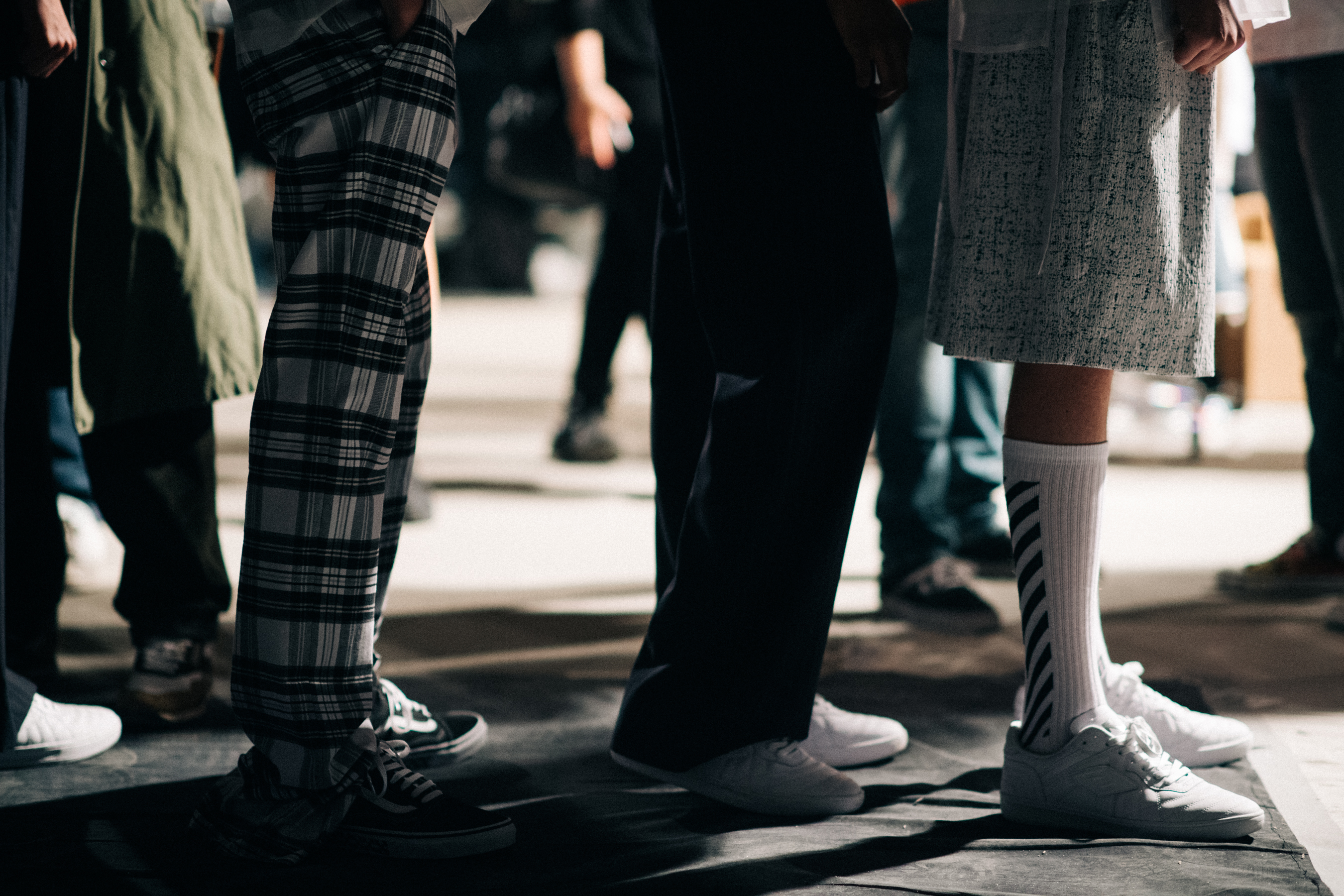 Male models wearing white shoes