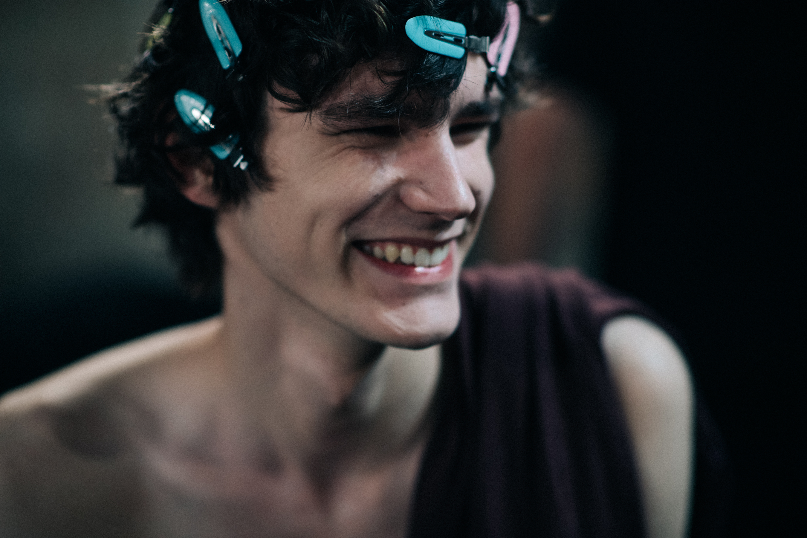 A model getting ready and smiling